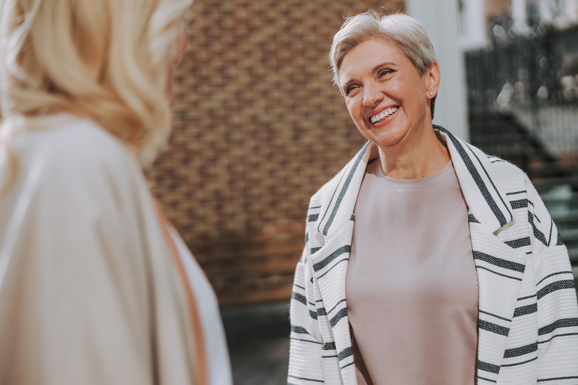 A woman smiling with gratitude | Source: Shutterstock