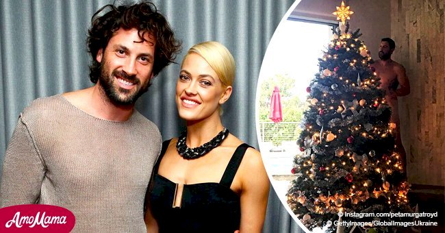 Maksim Chmerkovskiy poses completely naked behind a Christmas Tree, provoking fans to comment