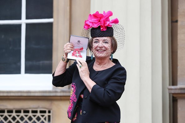 Rosa Monckton, a friend of the late Diana, Princess of Wales, poses for a photo after receiving an MBE by Queen Elizabeth II | Photo: Getty Images