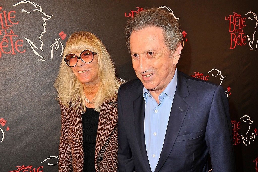 Dany Saval et Michel Drucker assistent à la première de "La Belle et la Bête" au théâtre Mogador le 20 mars 2014 à Paris, France. | Photo : Getty Images