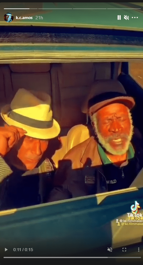 A picture of K.C. Amos and his dad John Amos lip-syncing to a song in the car. | Photo: Instagram/k.c.amos