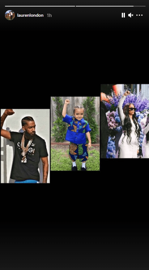 Lauren London shared a picture of her ex husband, her and their kid with their arm raised and fists bunched. | Photo: Instagram/Laurenlondon