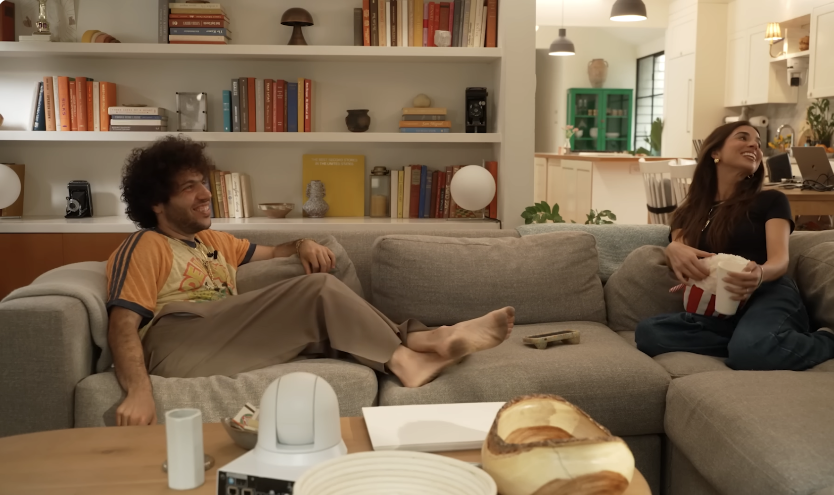 A bare feet Benny Blanco and Kristin Batalucco are seen in this podcast. | Source: YouTube/FriendsKeepSecrets