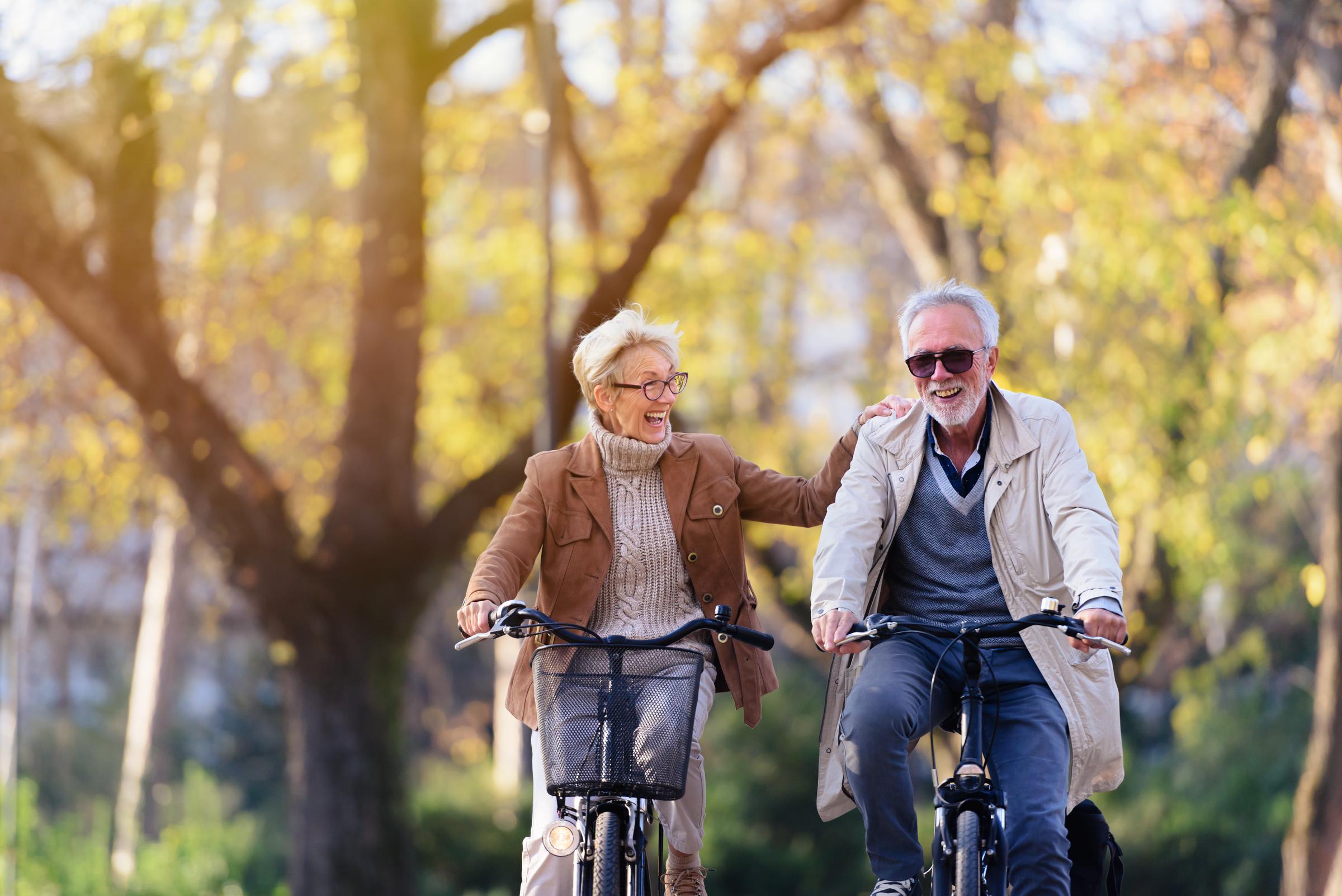 Mature couple biking | Source: Shutterstock