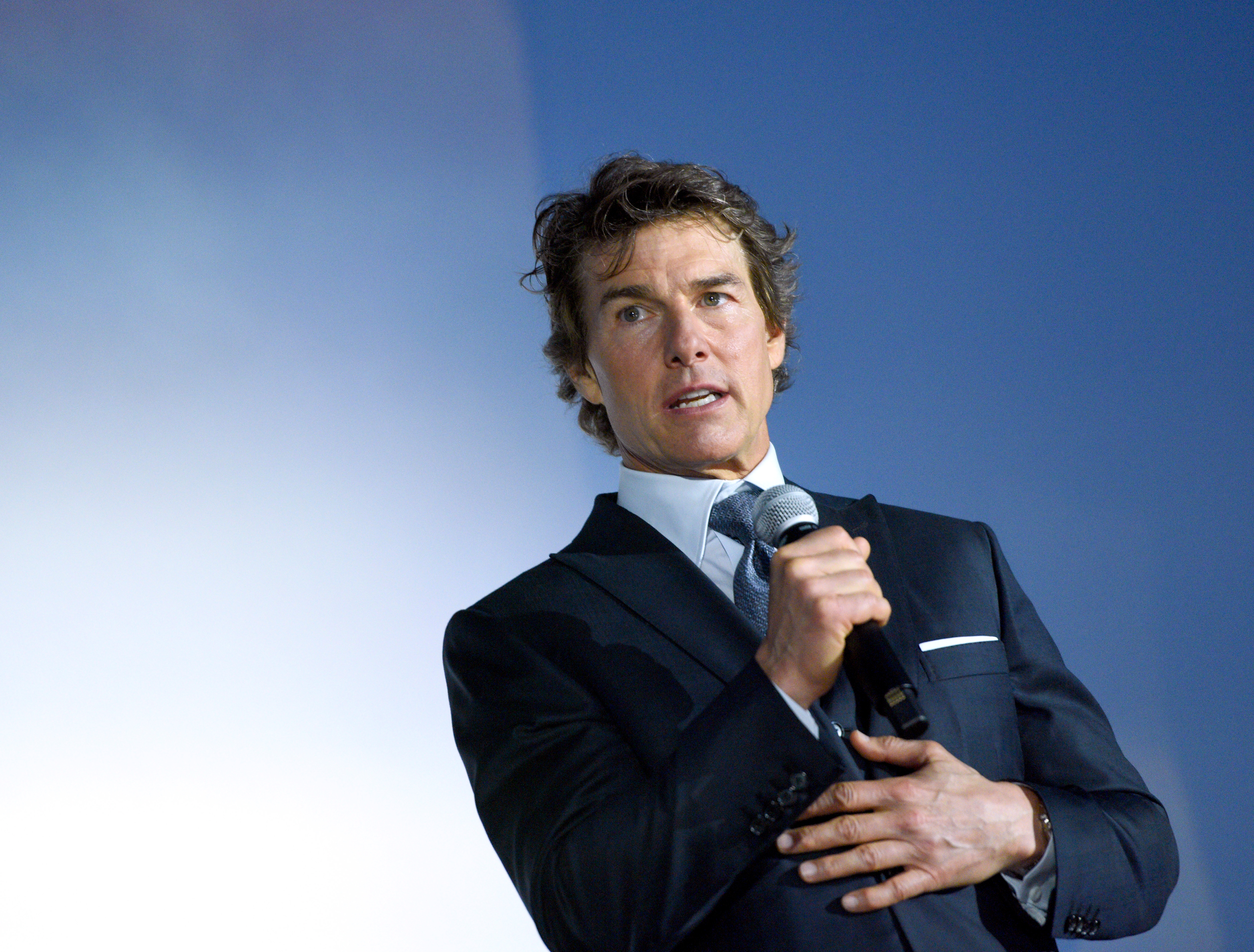 Tom Cruise speaks onstage during the Global Premiere of "Top Gun: Maverick" on May 4, 2022, in San Diego, California. | Source: Getty Images