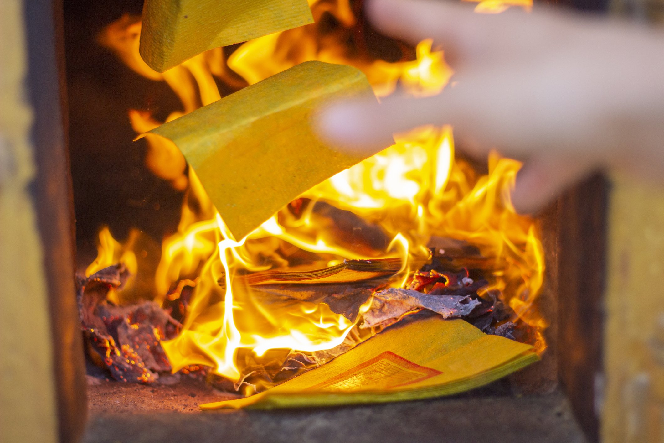 Paper Thrown Into Fire | Photo: Getty Images