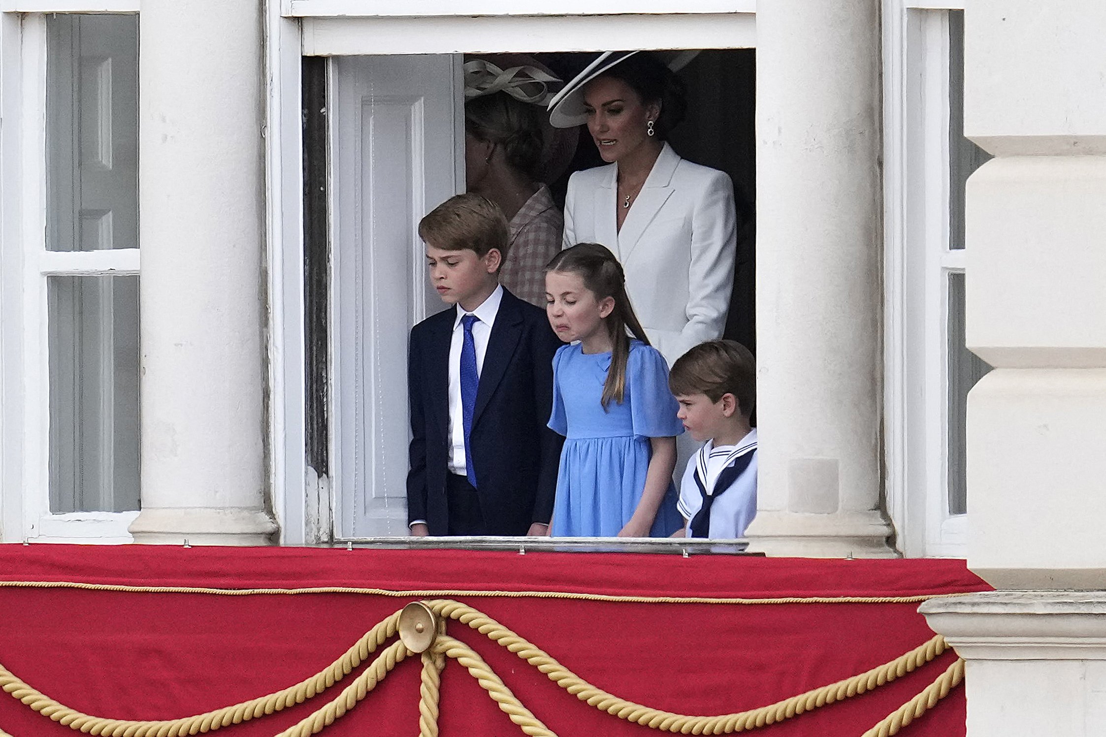 Princess Catherine of Wales stands with her children Prince George of Wales, Princess Charlotte of Wales and Prince Louis of Wales watch overlooking Horse Guards as the troops march past during the Queen's Birthday Parade, the Trooping the Colour, as part of Queen Elizabeth II's platinum jubilee celebrations, in London on June 2, 2022. | Source: Getty Images