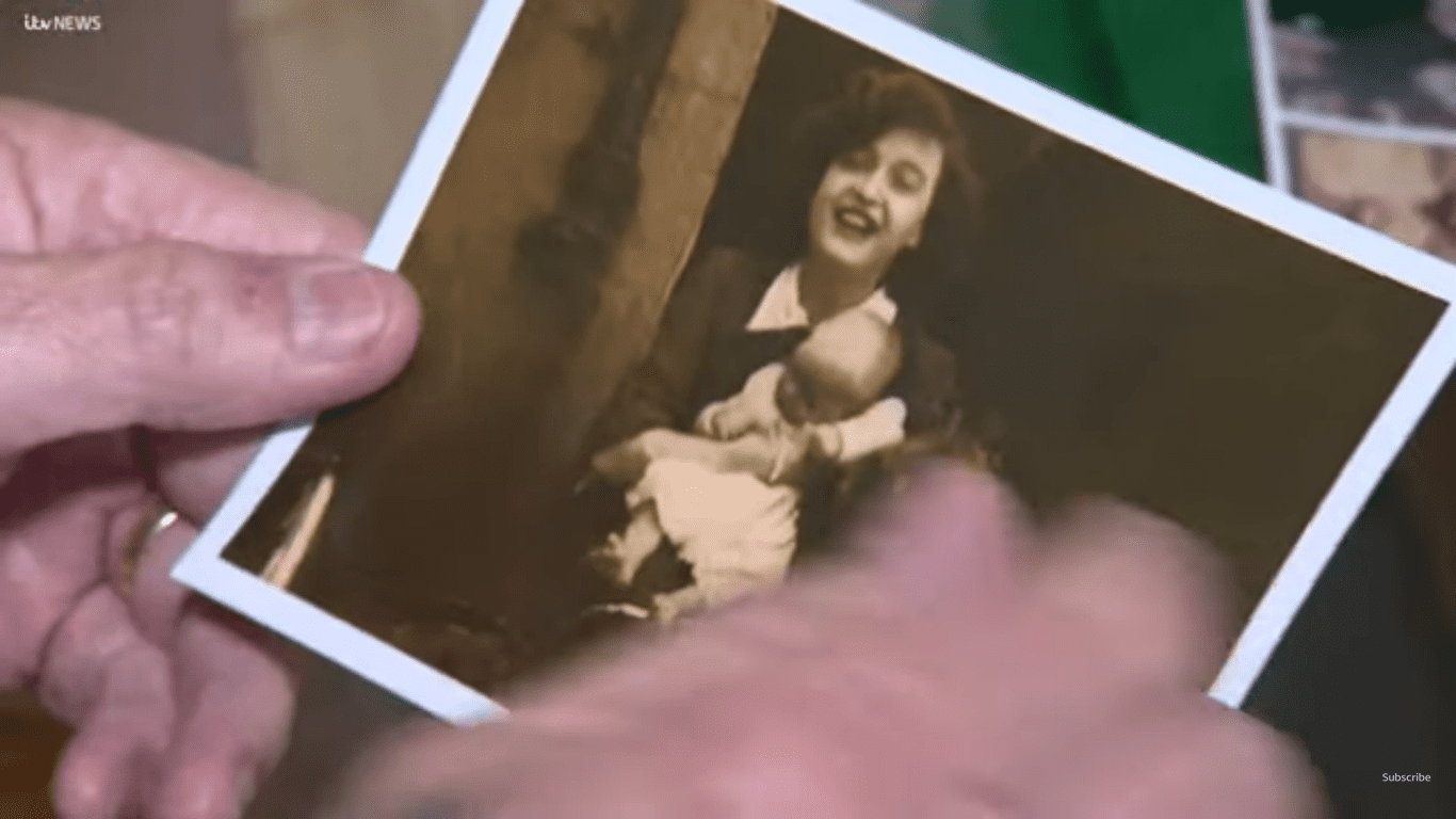 A picture of Margaret Shimkus in her prime holding one of her children. | Photo: Youtube.com/ITV News