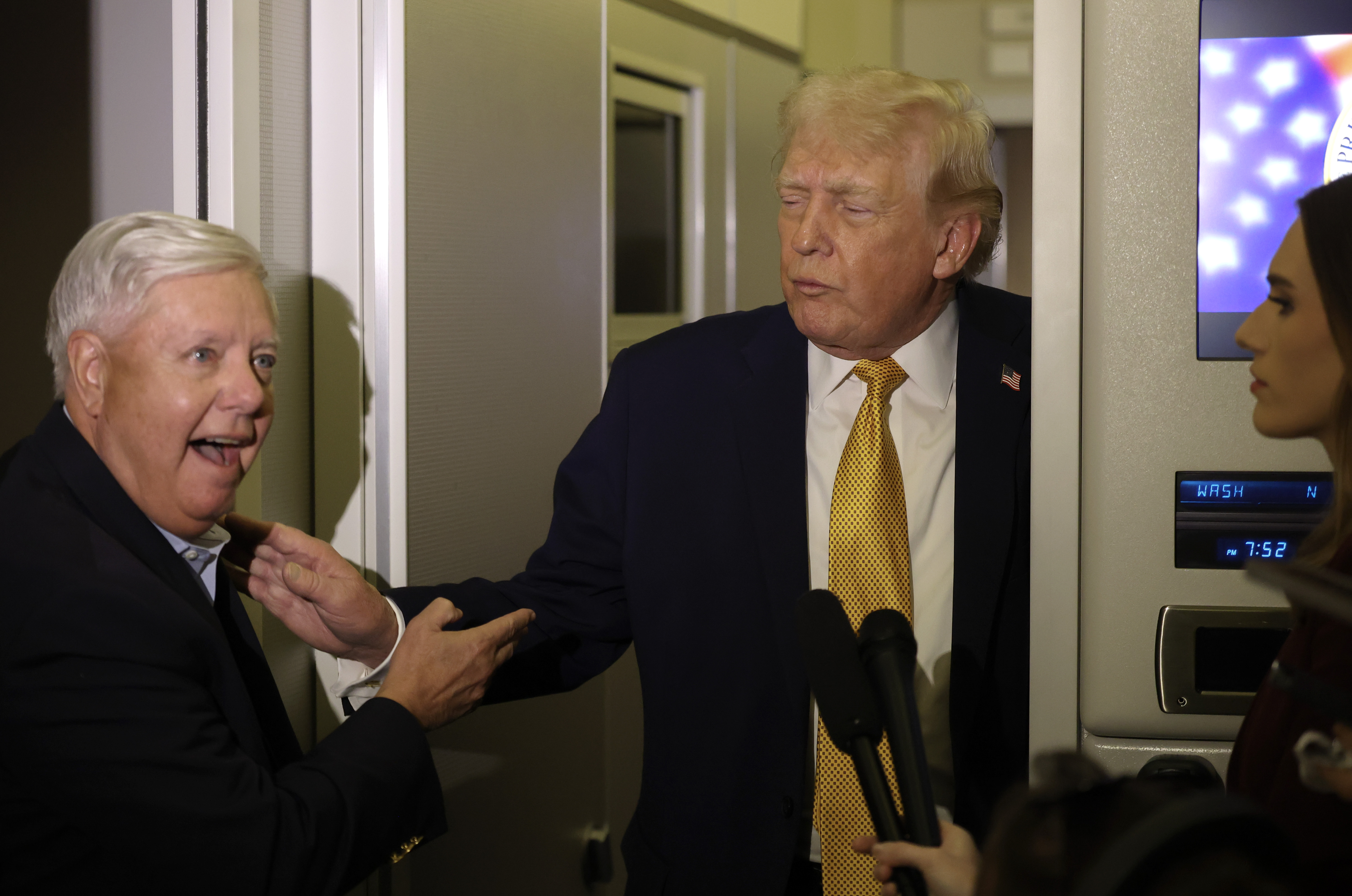 President Donald Trump and Senator Lindsey Graham speak with reporters aboard Air Force One on January 4, 2026. Trump later said he spoke with Graham just hours before his death and believed they would see each other again the next day. | Source: Getty Images