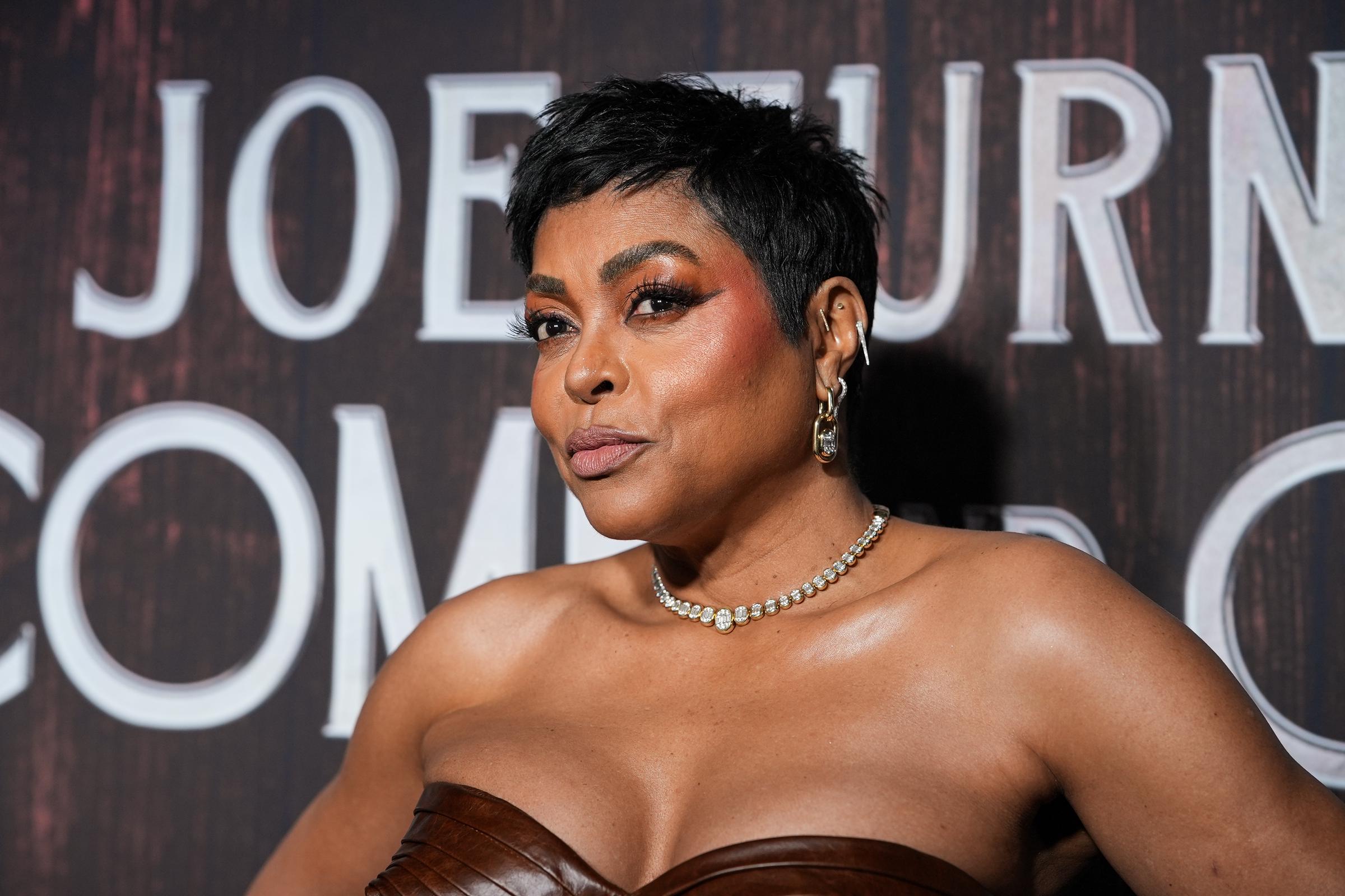 Taraji P. Henson attends "Joe Turner’s Come and Gone" opening night, captured in a closer angle as she turns her shoulders toward the camera, lips slightly pursed and chin angled forward, with her arms relaxed just below frame.
