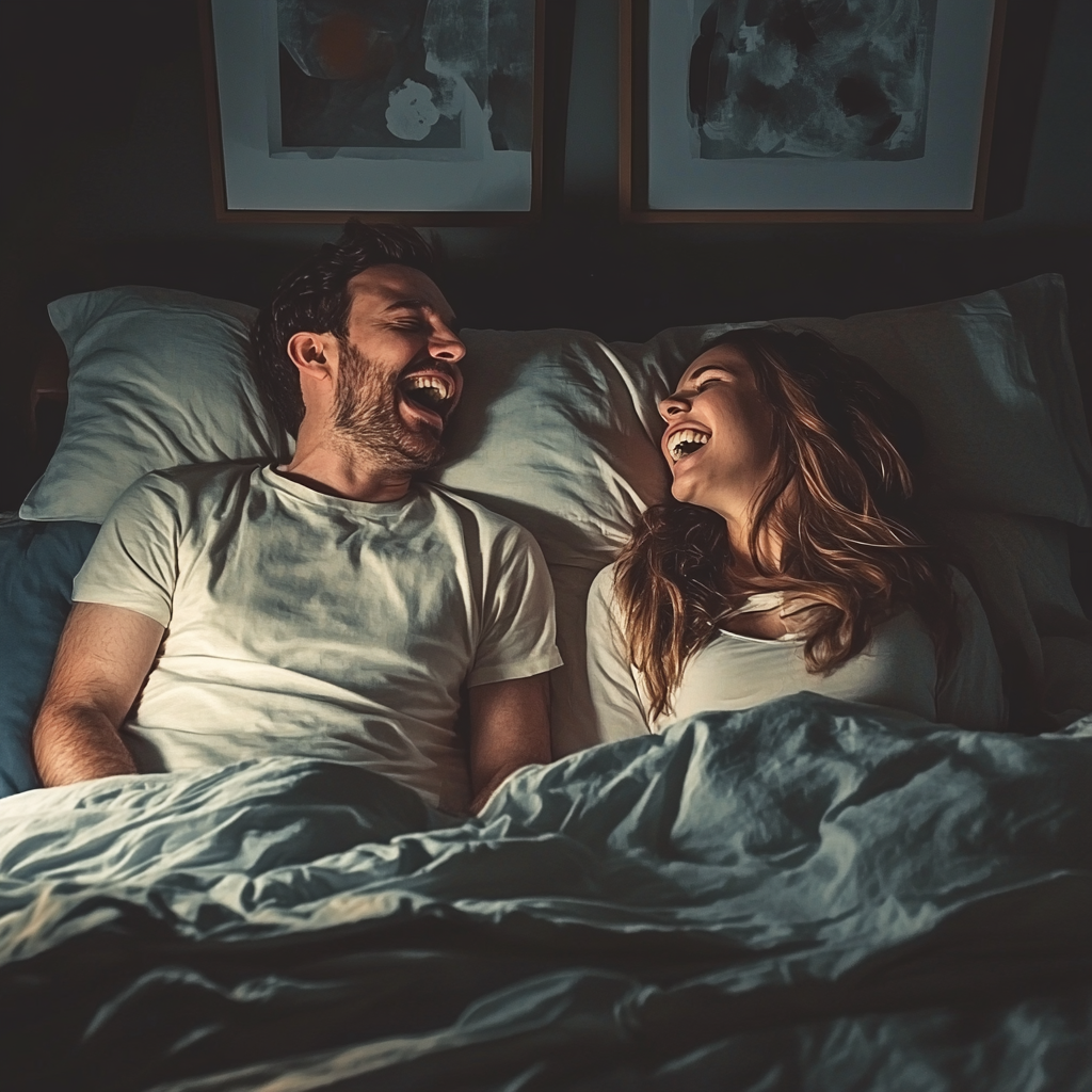 A man and woman laughing in bed | Source: Midjourney