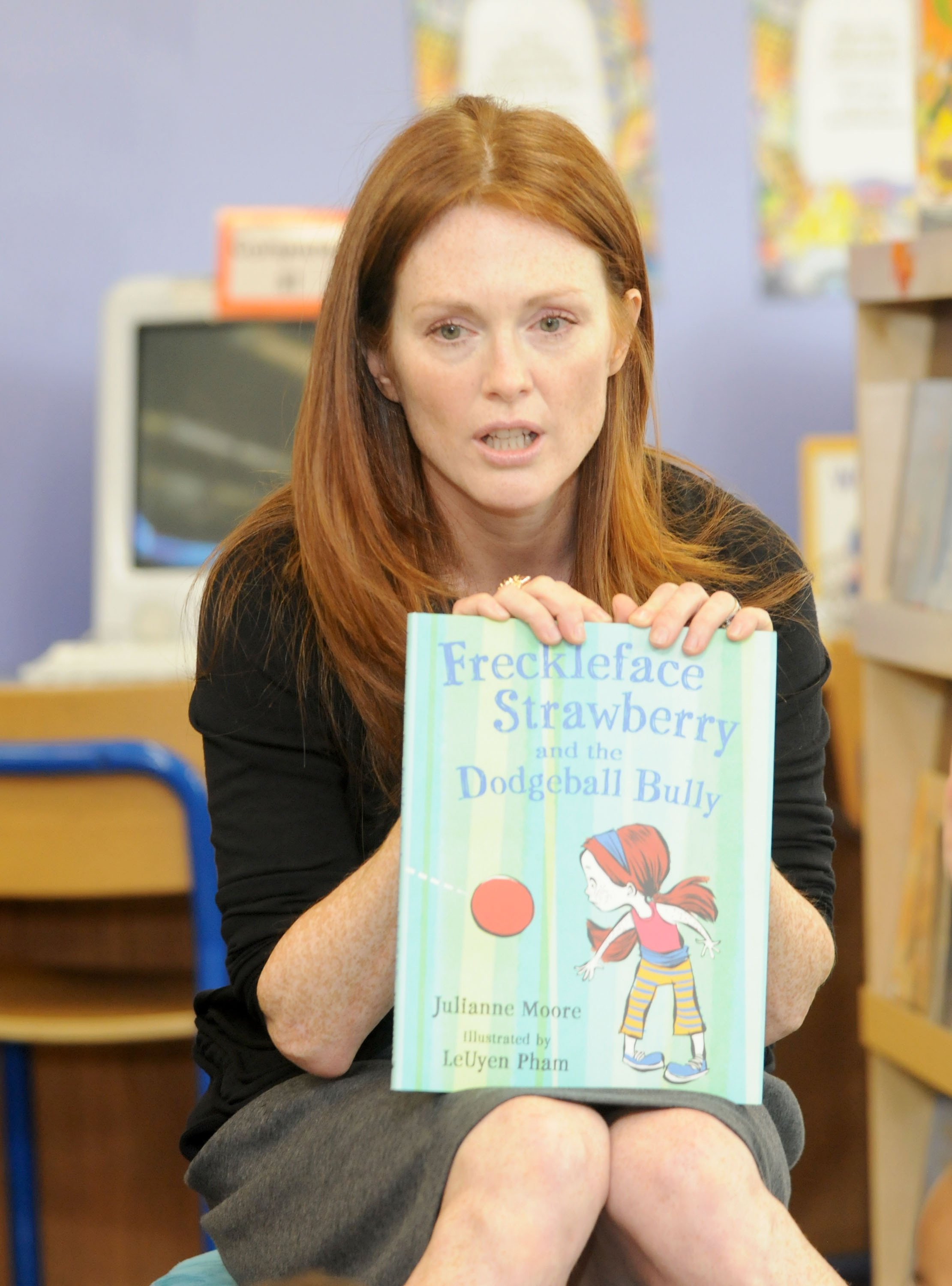 Actress and author Julianne Moore reads her book "Freckleface Strawberry and the Dodgeball Bully" to students at PS 142 during DIOR And Fund For Public Schools Celebrate Shop For Public Schools kickoff at PS 142 on October 1, 2009, in New York City | Source: Getty Images