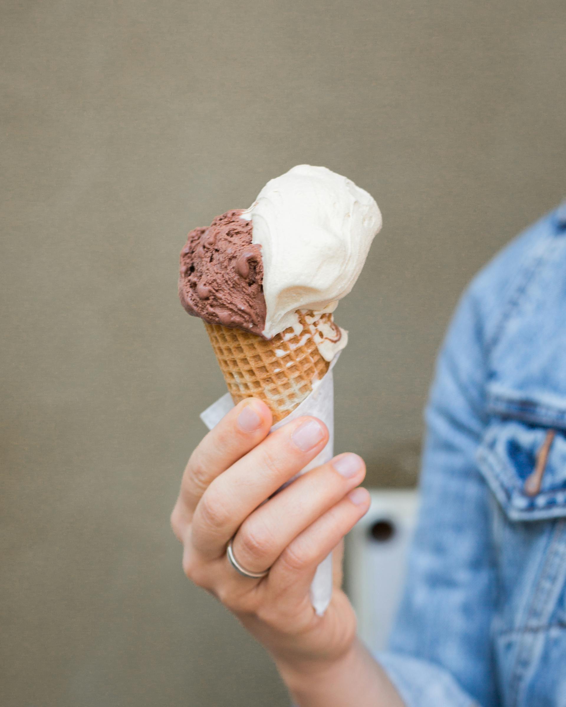 A person holding an ice cream cone | Source: Pexels