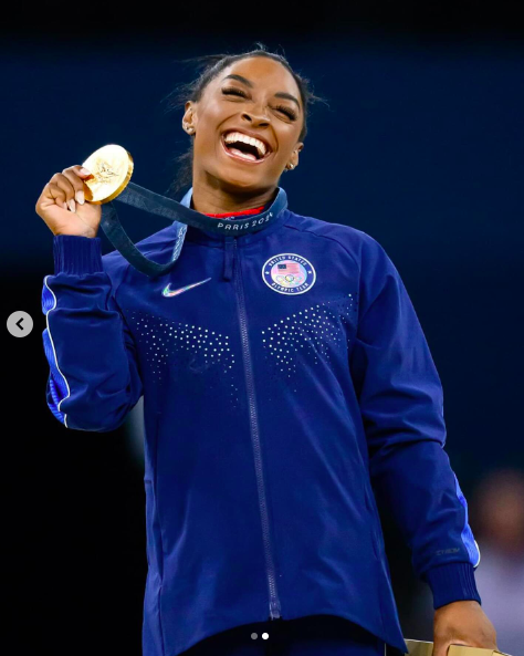 Simone Biles posing with her gold medal during the Paris Olympics, posted on August 4, 2024 | Source: Instagram/simonebiles