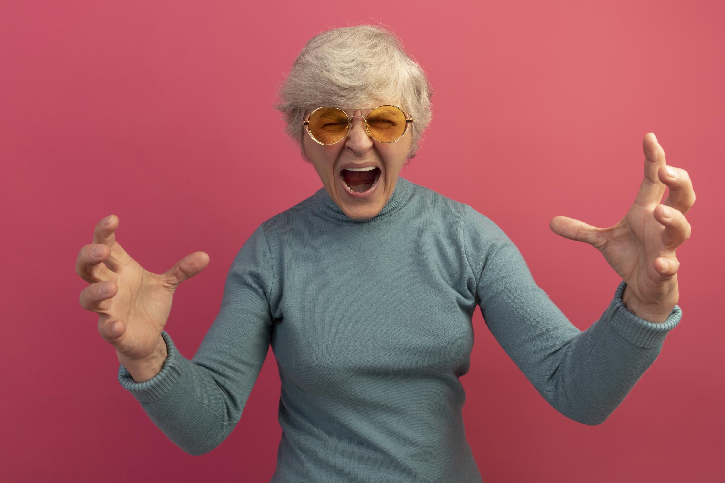 A shocked elderly woman | Source: Freepik