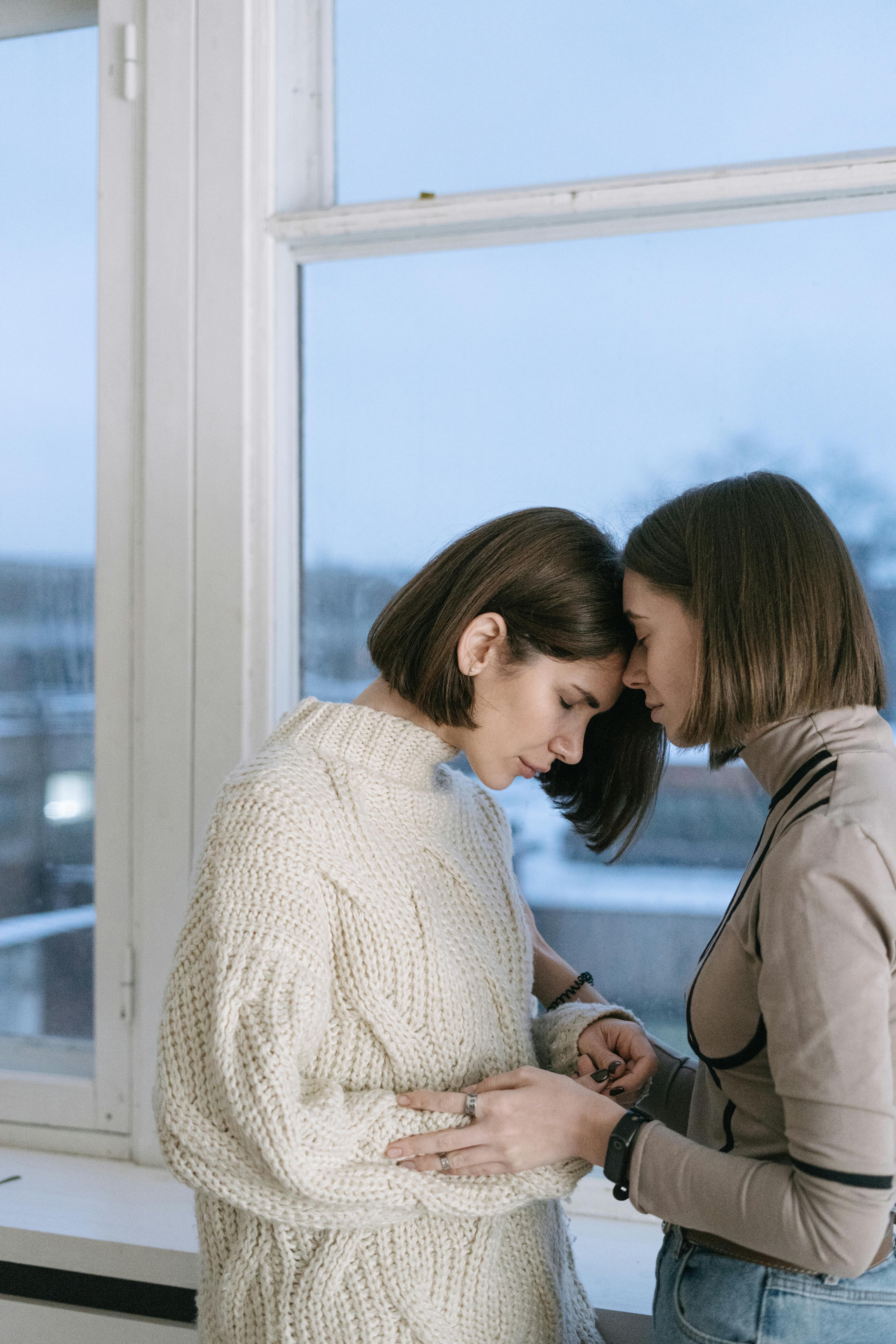 Two emotional women sharing a touching moment | Source: Pexels