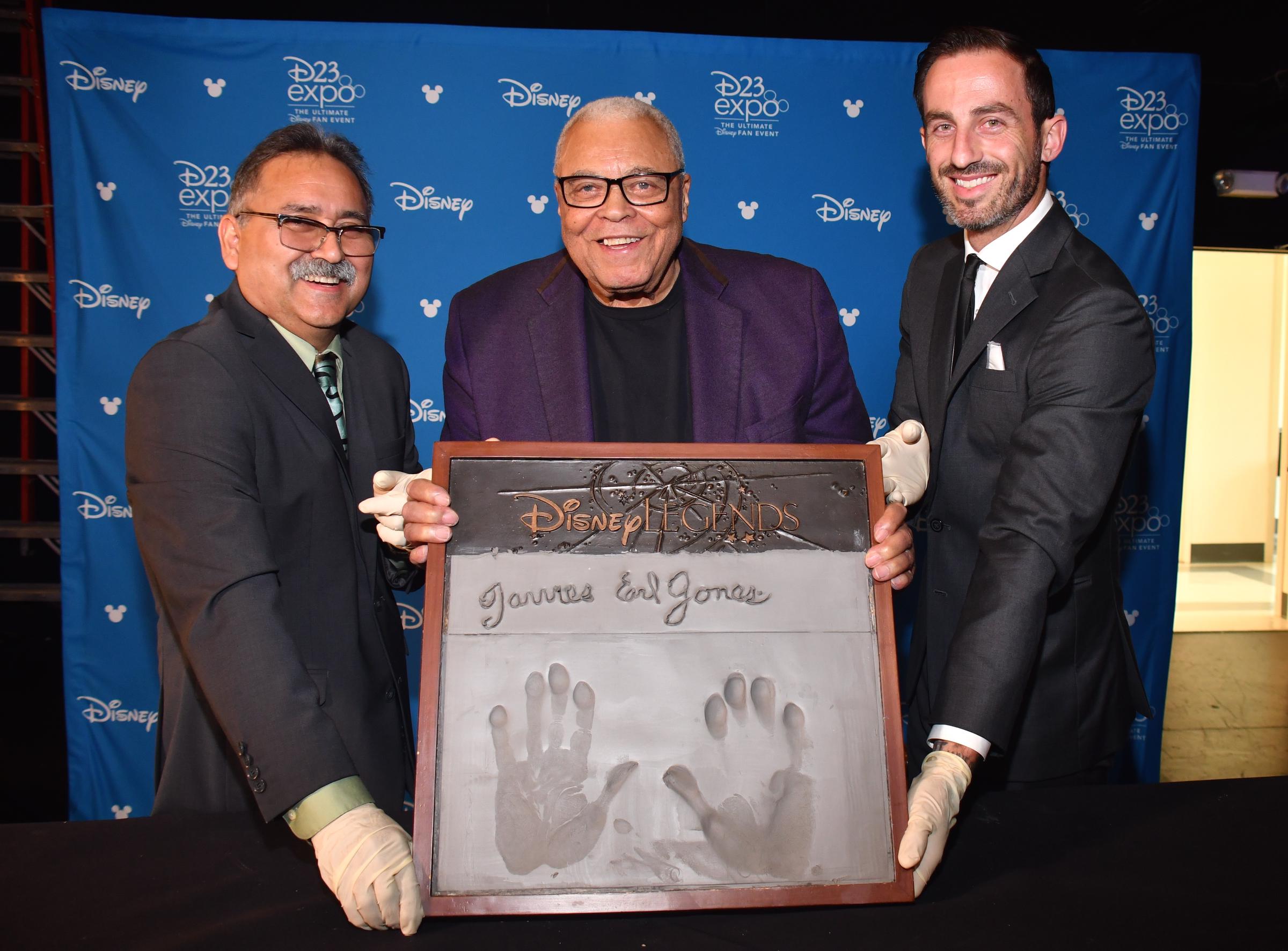 James Earl Jones shown casting his hand in cement for Disney during a special event on July 10, 2019, in Pawling, New York. | Source: Getty Images