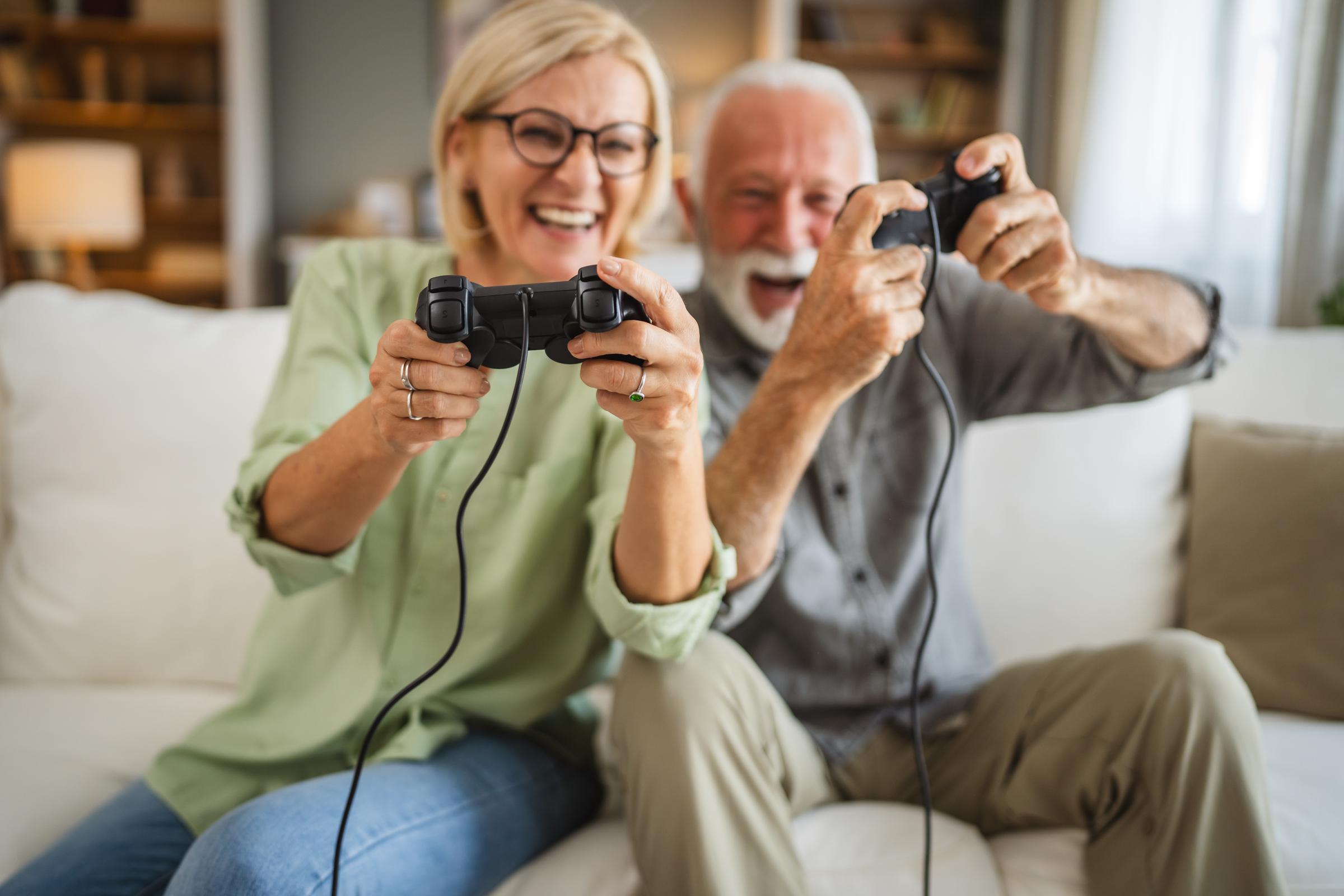 Mature couple playing a video game | Source: Shutterstock