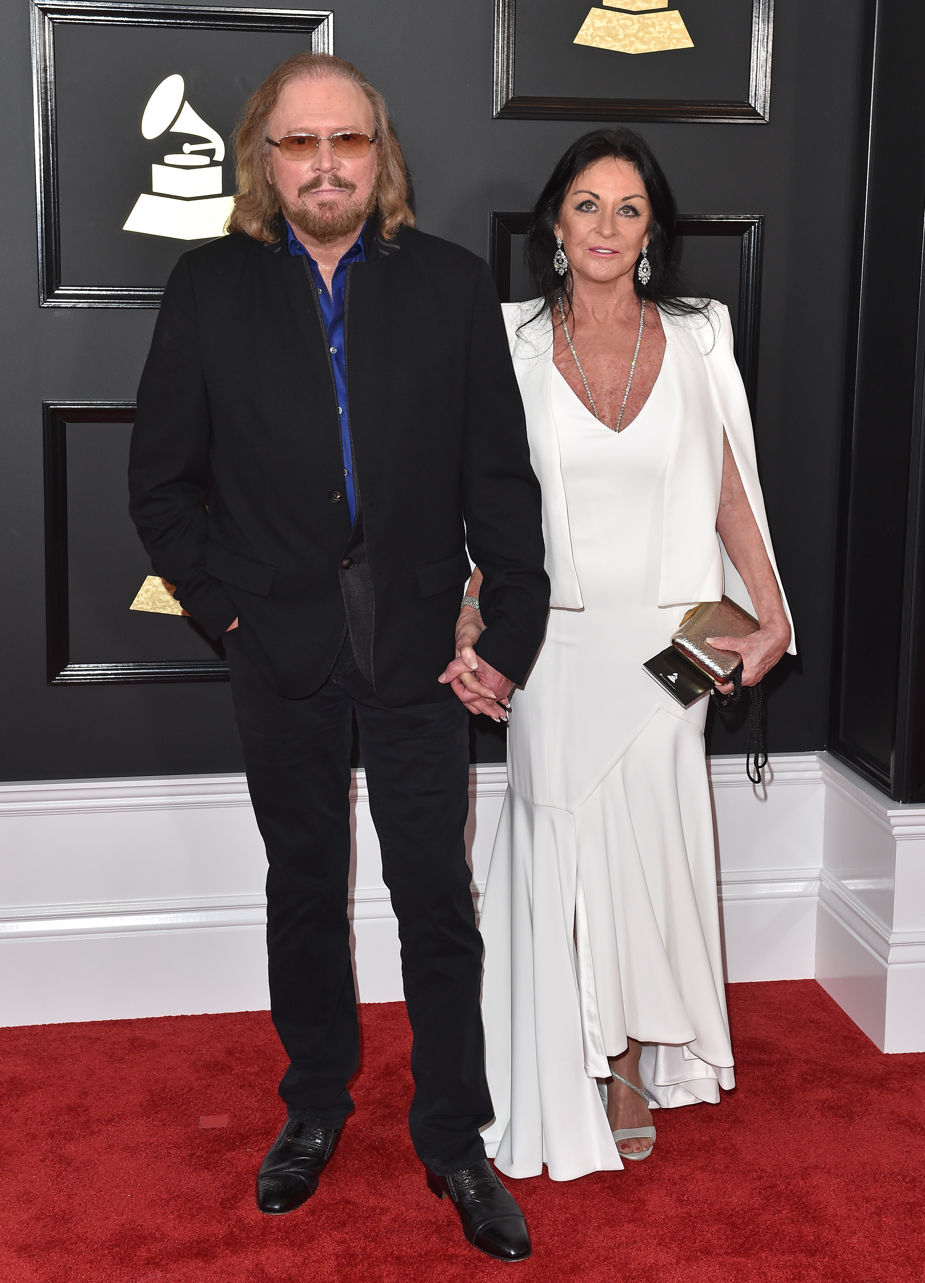 Barry Gibb and Linda Gray at the 59th Grammy Awards in Los Angeles, 2017 | Source: Getty Images