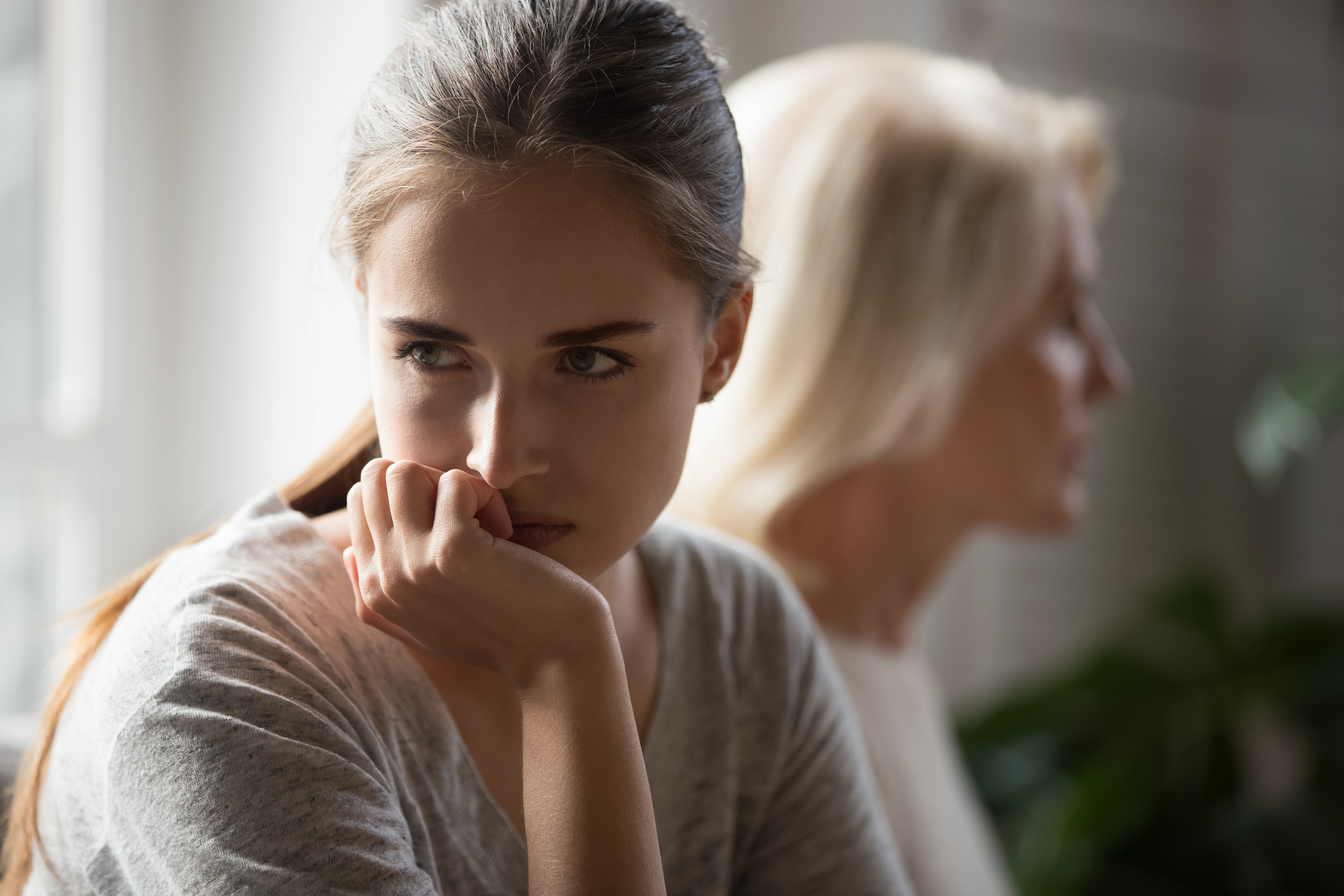 Stubborn mom and daughter avoid talking after conflict | Source: Getty Images