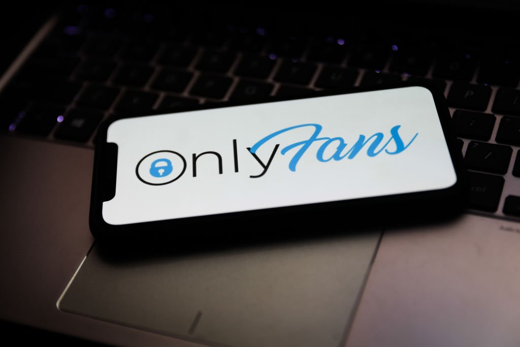 OnlyFans logo is seen displayed on a phone screen. | Source: Getty Images