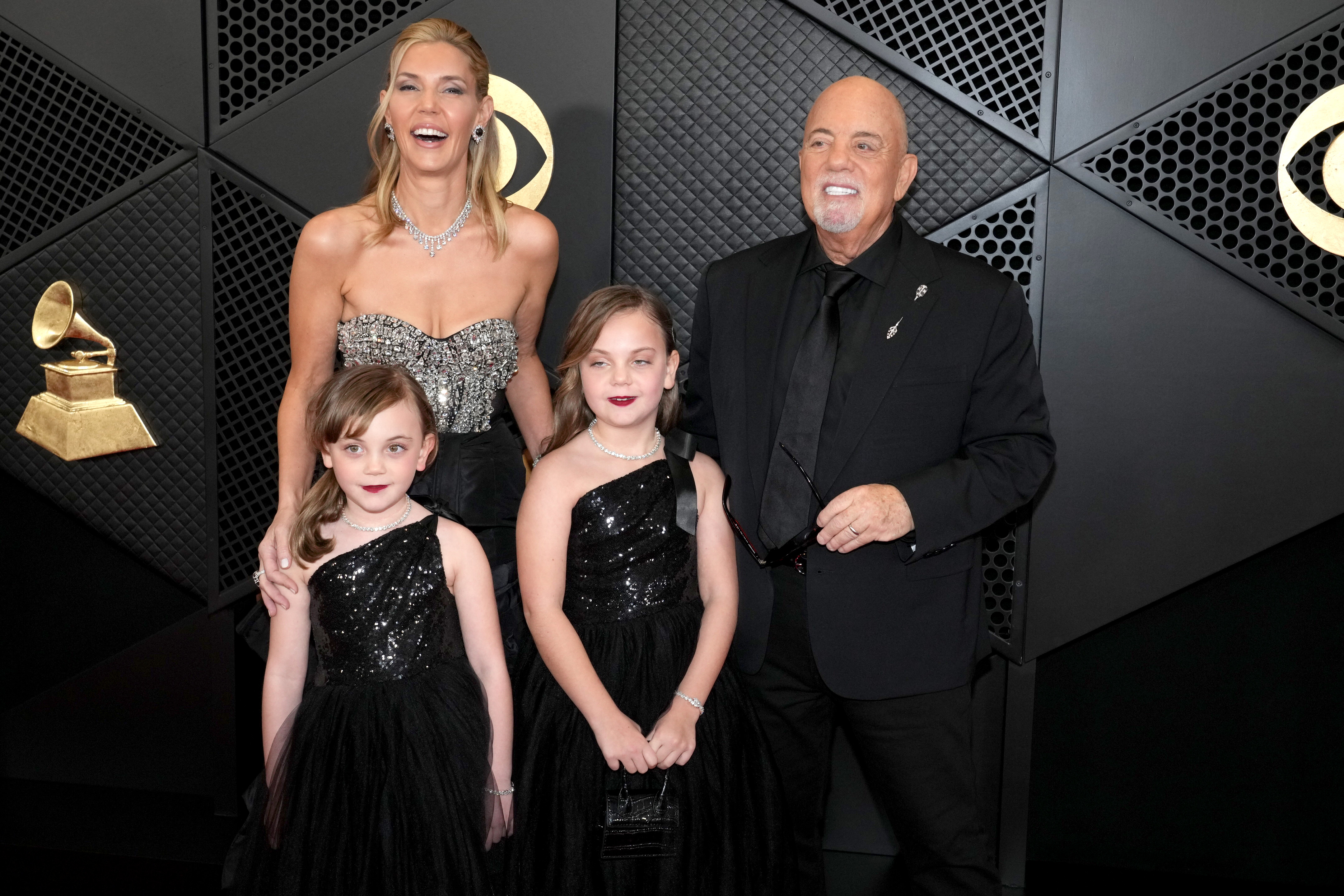 Billy Joel, with his wife, Alexis Roderick, and their daughters, Della and Remy Joel, at the 66th Grammy Awards on February 4, 2024, in Los Angeles, California. | Source: Getty Images