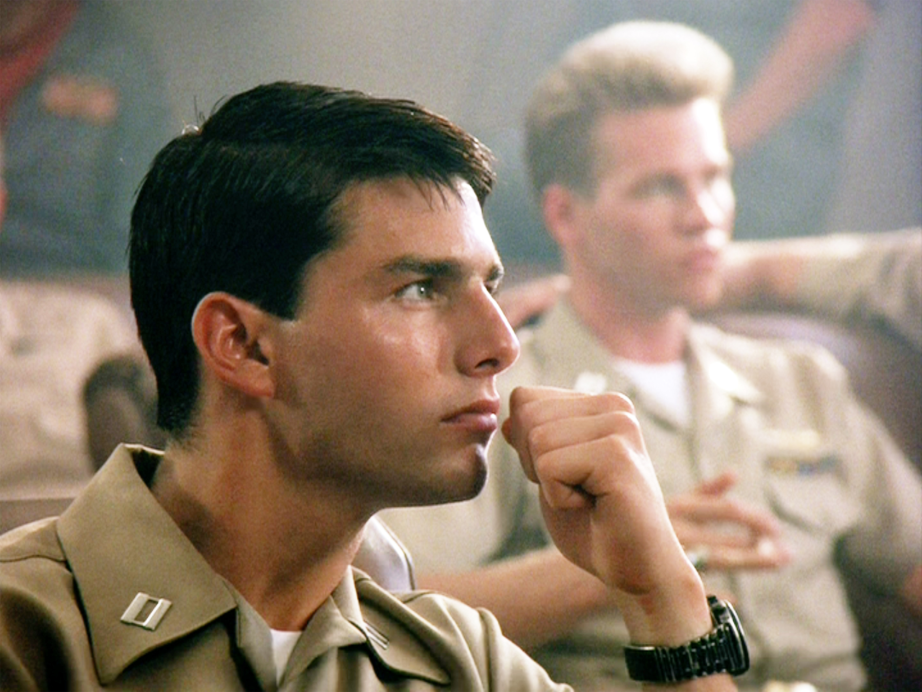 Tom Cruise as Lt. Pete "Maverick" Mitchell and Val Kilmer as Lt. Tom 'Iceman' Kazansky (background) in the movie, "Top Gun," circa 1986 | Source: Getty Images