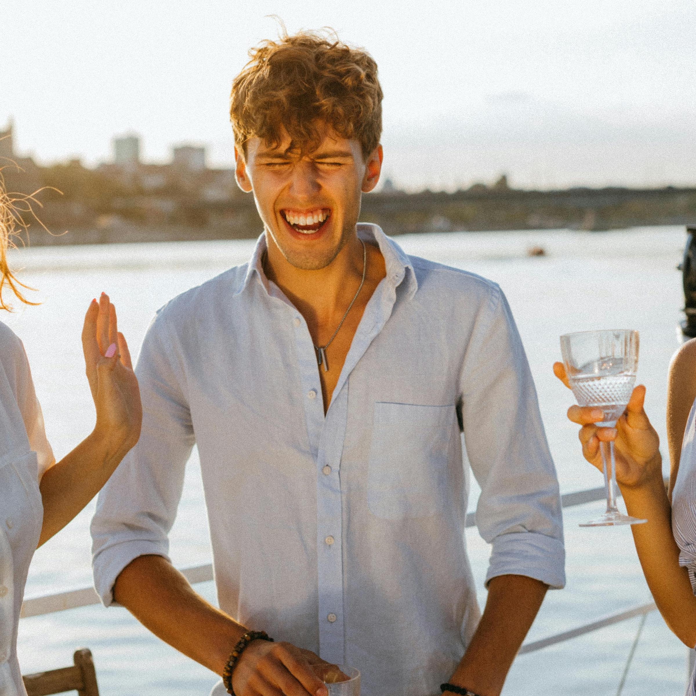 A man on the deck of a yacht, laughing | Source: Pexels