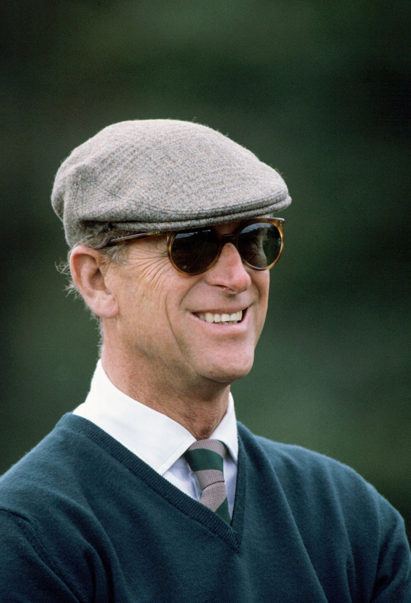 Prince Philip wearing sunglasses and a cap at Windsor Great Park during the Windsor Horse Show, circa 1990s. | Photo: Getty Images