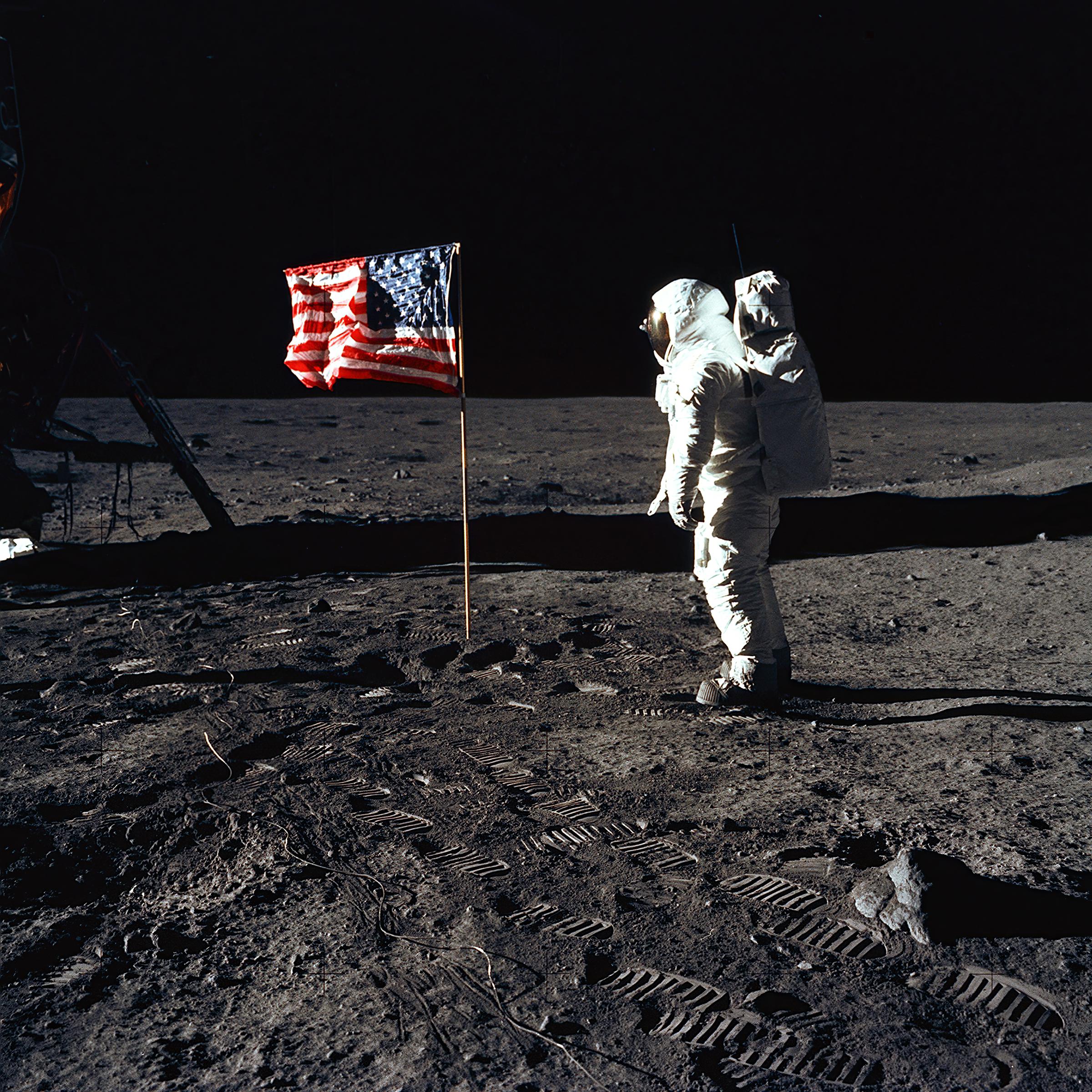 Astronaut Edwin E. "Buzz" Aldrin, Jr., beside the U.S. flag during an Apollo 11 moon walk in 1969. | Source: Getty Images