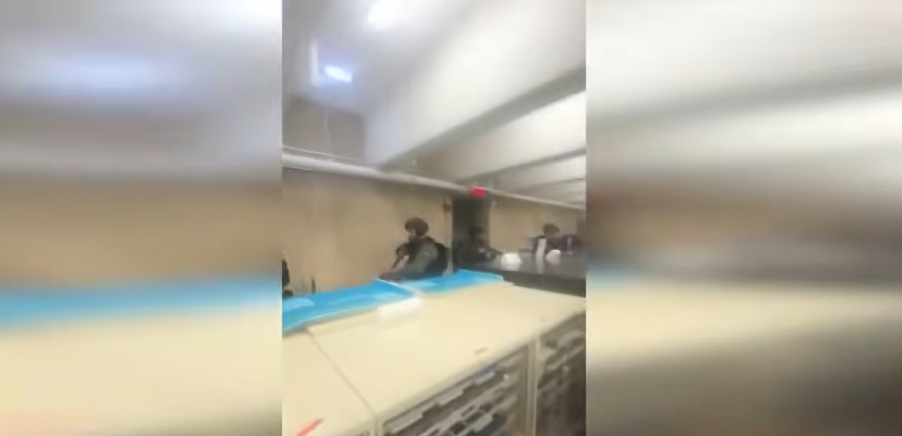 Authorities entering the library to showcase the area, dated December 14, 2025 | Source: YouTube/WCVB Channel 5 Boston