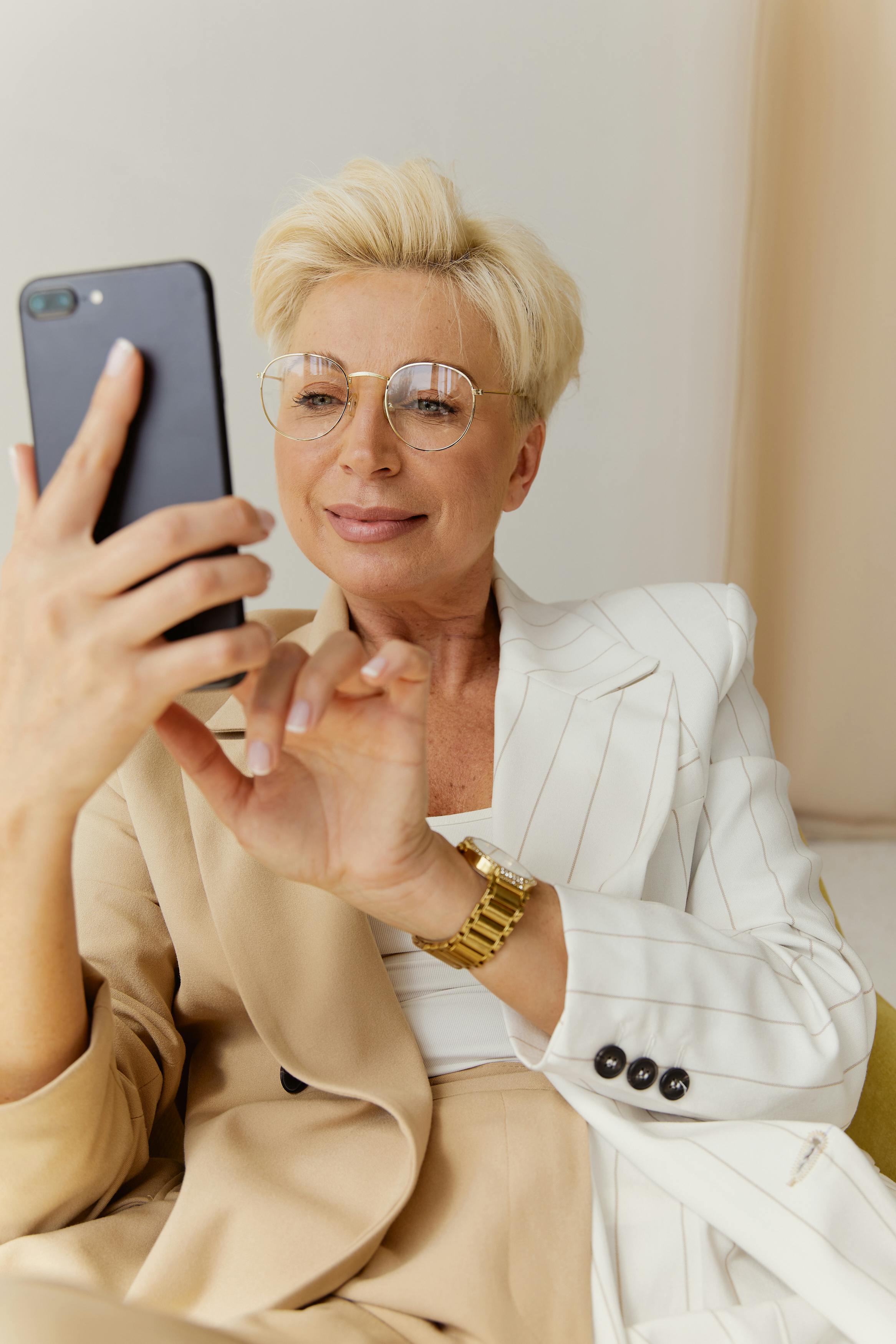 A woman watching vertical dramas on her phone | Source: Pexels