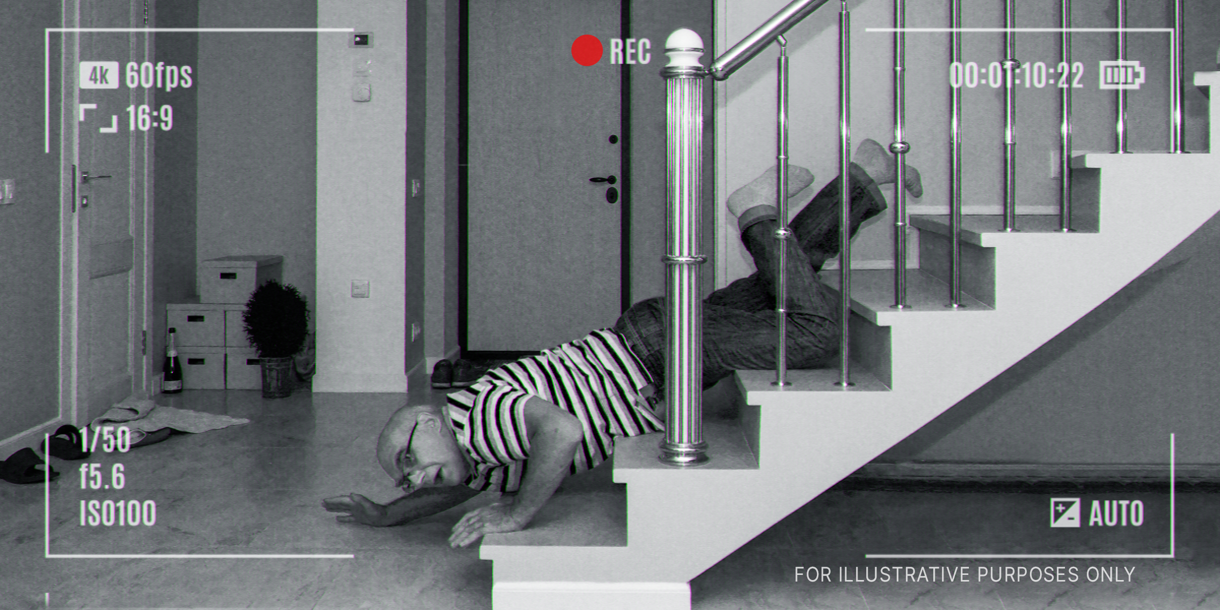 Schwarz-Weiß-Kameraaufnahmen, die einen Mann zeigen, der eine Treppe hinuntergefallen ist | Quelle: Shutterstock