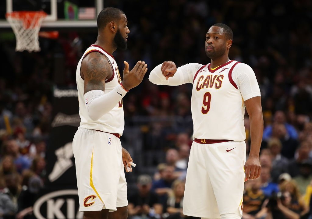 LeBron James #23 of the Cleveland Cavaliers talks with Dwyane Wade #9 while playing the Miami Heat at Quicken Loans Arena | Photo: Getty Images