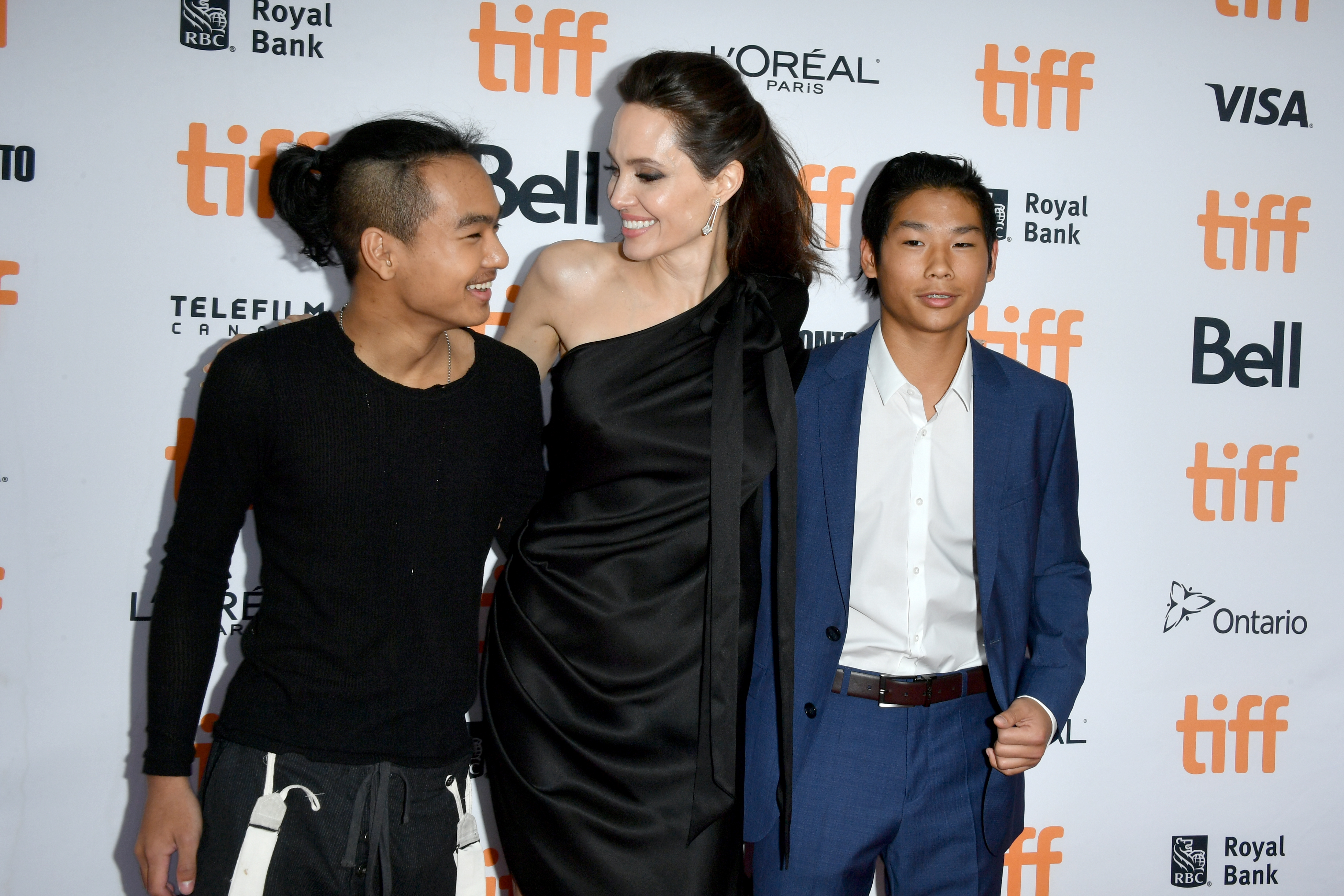 Angelina Jolie with his son Maddox and Pax in Toronto in. 2017 | Source: Getty Images