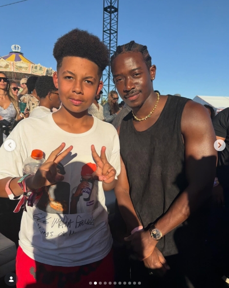 Sebastian "Bash" Taylor Thomaz poses with actor Damson Idris during Coachella in a photo shared by Amber Rose on April 12, 2026. | Source: Instagram/amberrose