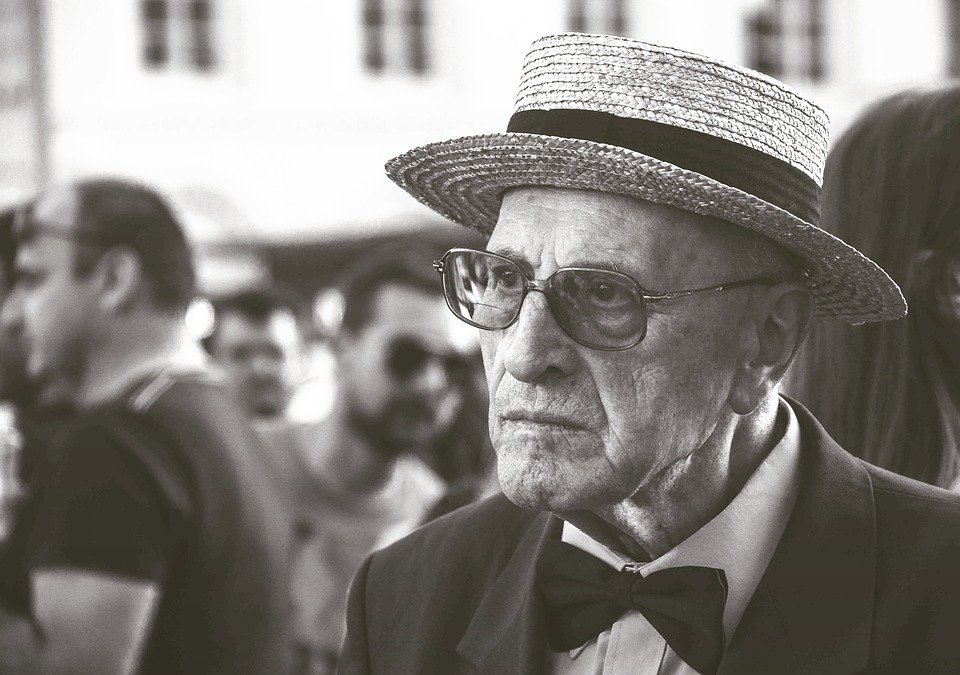 A black and white photo of a senior man staring at the camera. | Photo: Pixabay