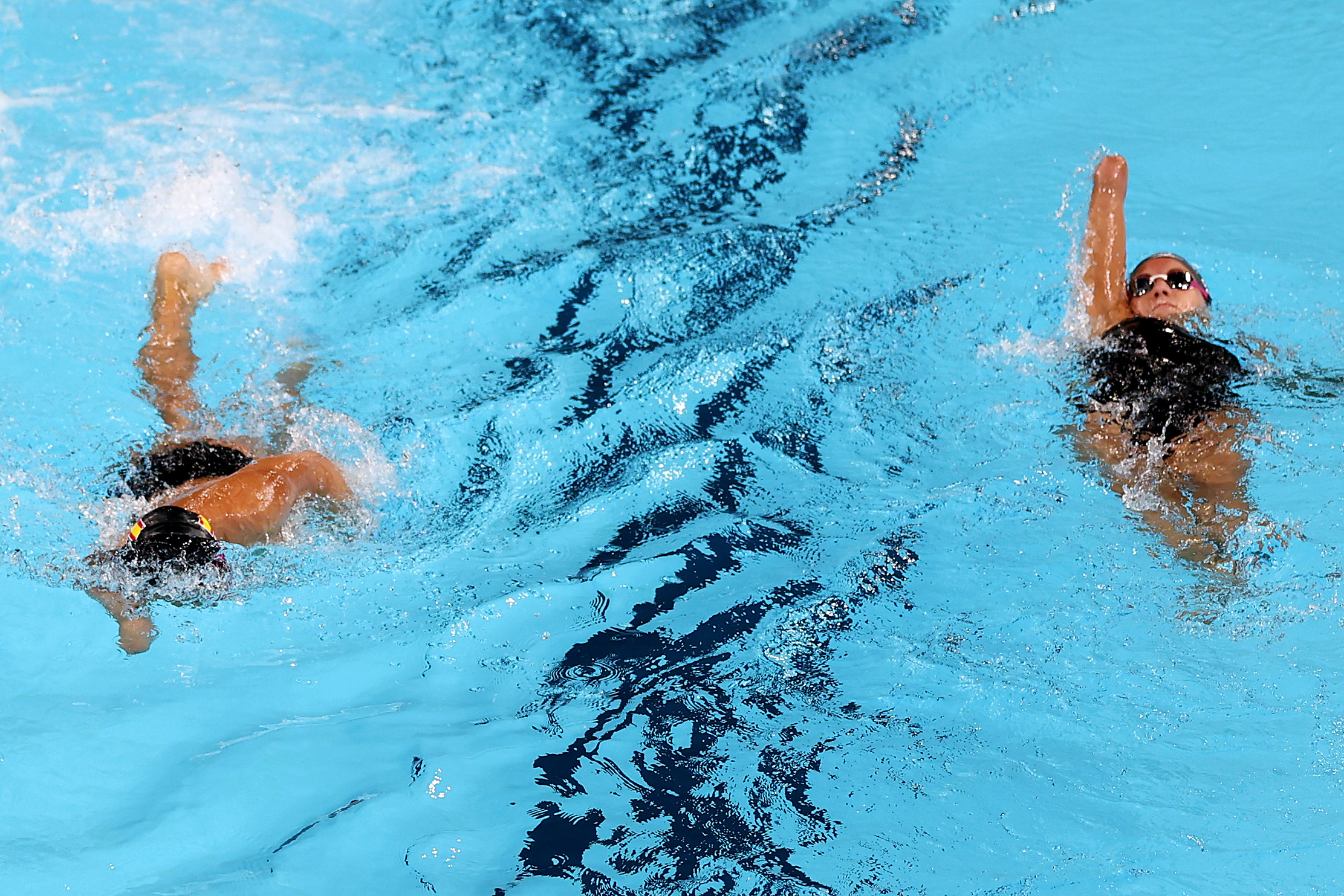 Competitors swim laps at the Paris 2024 Summer Paralympic Games on August 26, 2024 | Source: Getty Images