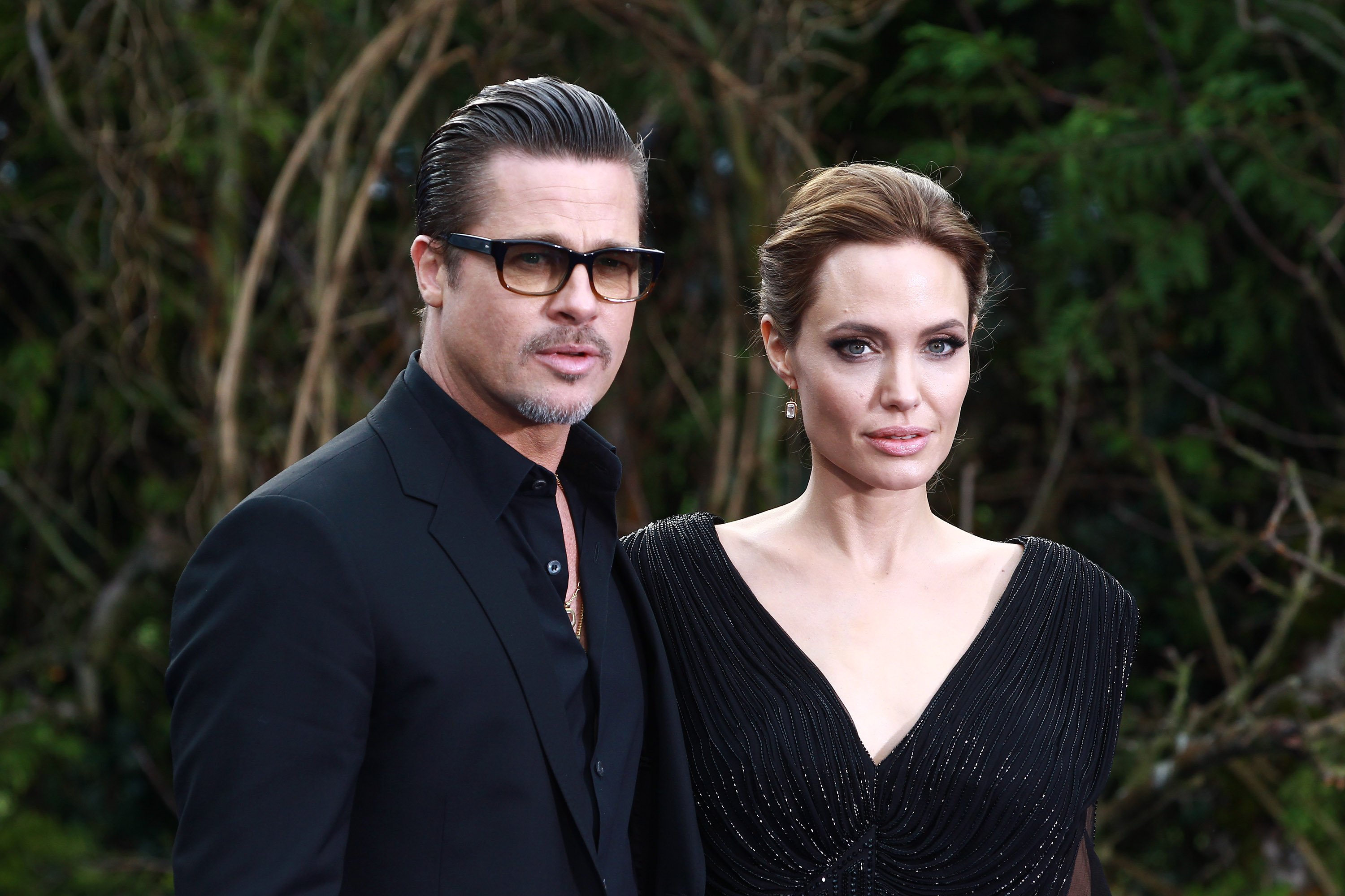 Brad Pitt and Angelina Jolie attend a private reception as costumes and props from Disney's "Maleficent" are exhibited in support of Great Ormond Street Hospital at Kensington Palace on May 8, 2014 in London, England. | Source: Getty Images