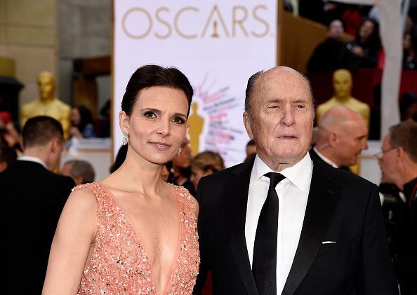  Luciana Pedraza (L) and actor Robert Duvall attend the 87th Annual Academy Awards at Hollywood & Highland Center on February 22, 2015 in Hollywood, California | Photo: Getty Images