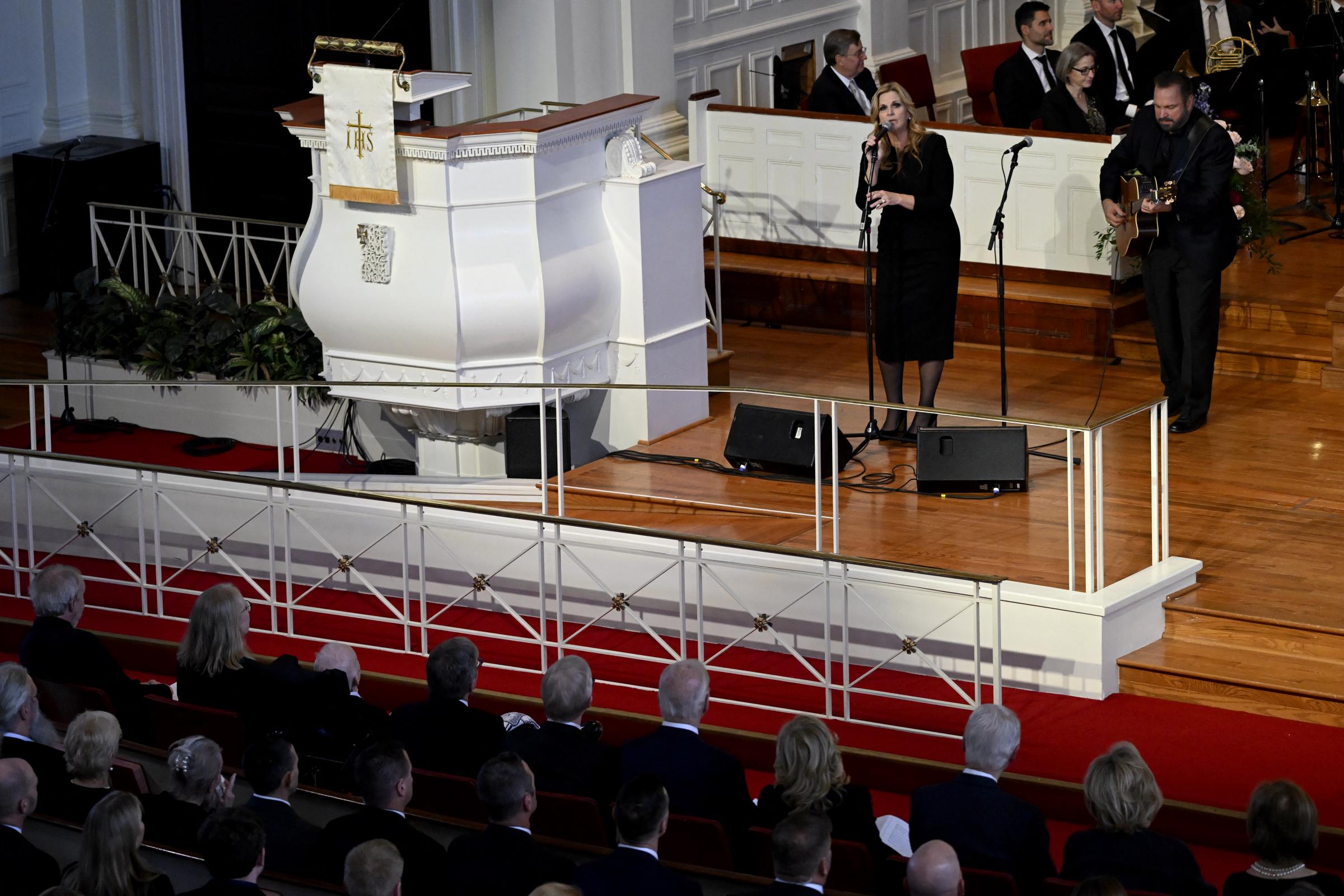 Garth Brooks and Trisha Yearwood perform "Imagine" at a tribute service for former US first lady Rosalynn Carter at Glenn Memorial Church at Emory University in Atlanta, on November 28, 2023 | Source: Getty Images