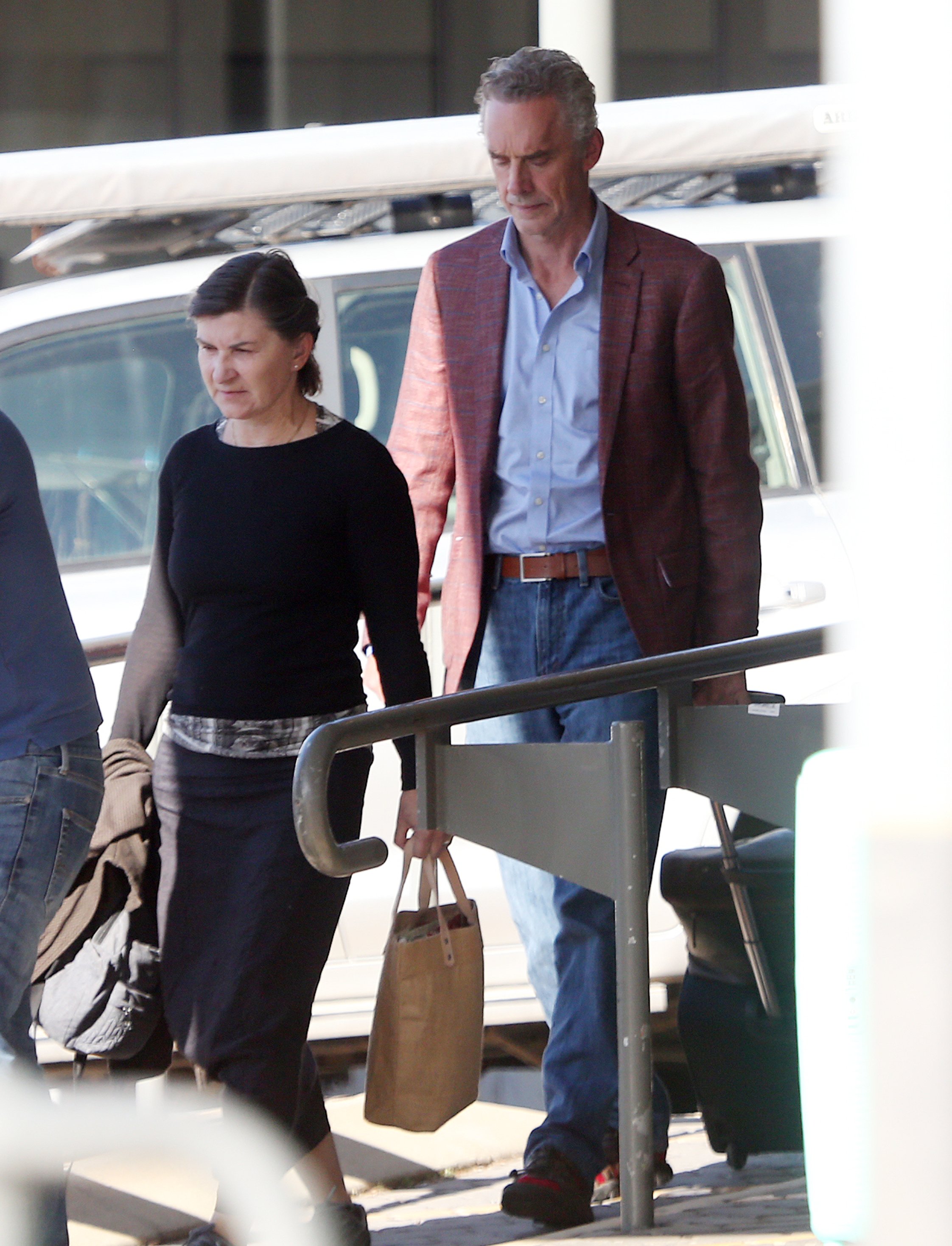 Jordan Peterson and Tammy Peterson are seen carrying their luggage at Perth Airport in Peth, Australia, on November 28, 2022. | Source: Getty Images