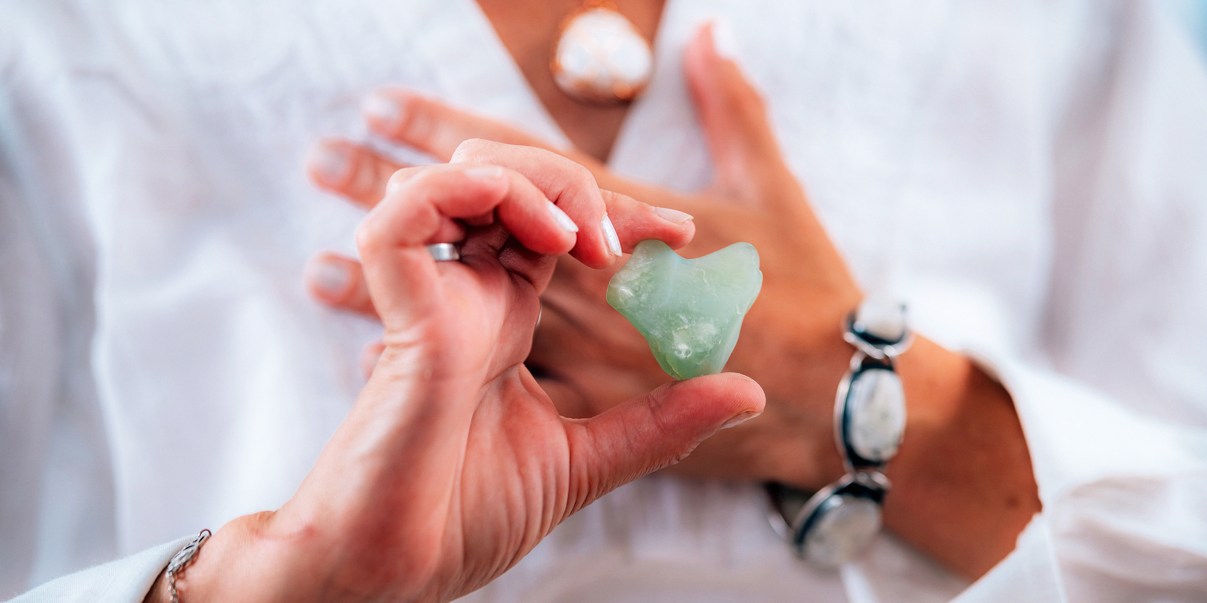 Meditating with moldavite | Source: Shutterstock