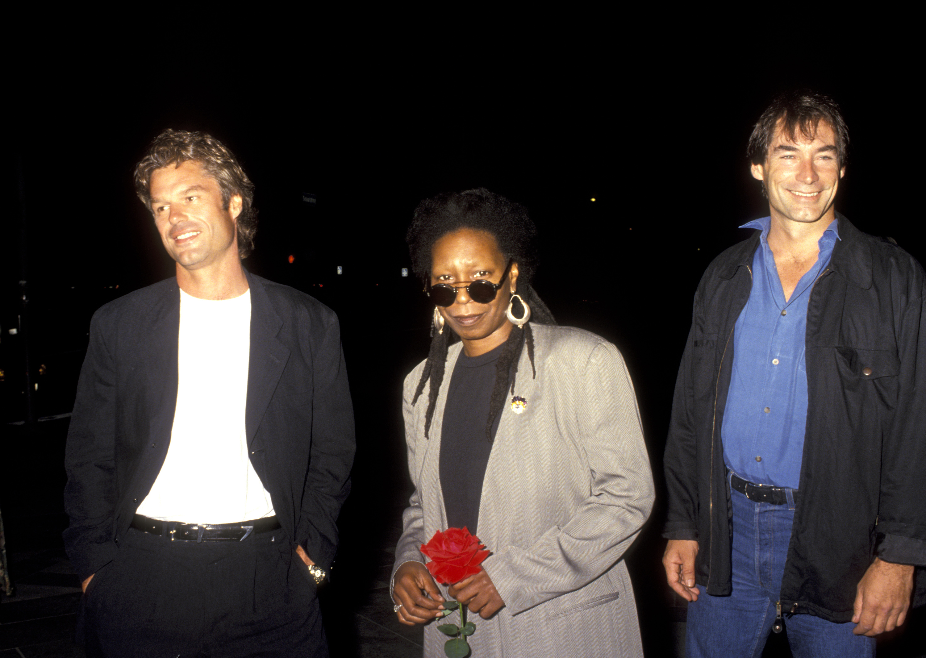 Harry Hamlin, Whoopi Goldberg, and Timothy Dalton at the "Sarafina" premiere in Los Angeles, 1992 | Source: Getty Images