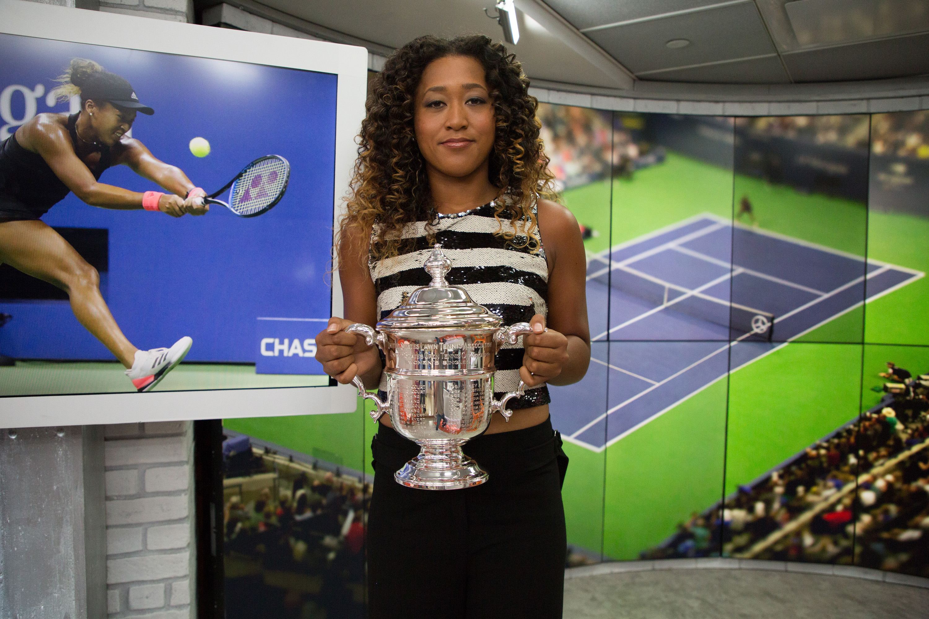 Naomi Osaka holding her trophy during a Season 67 episode of "Today" on September 10, 2018. | Source: Getty Images