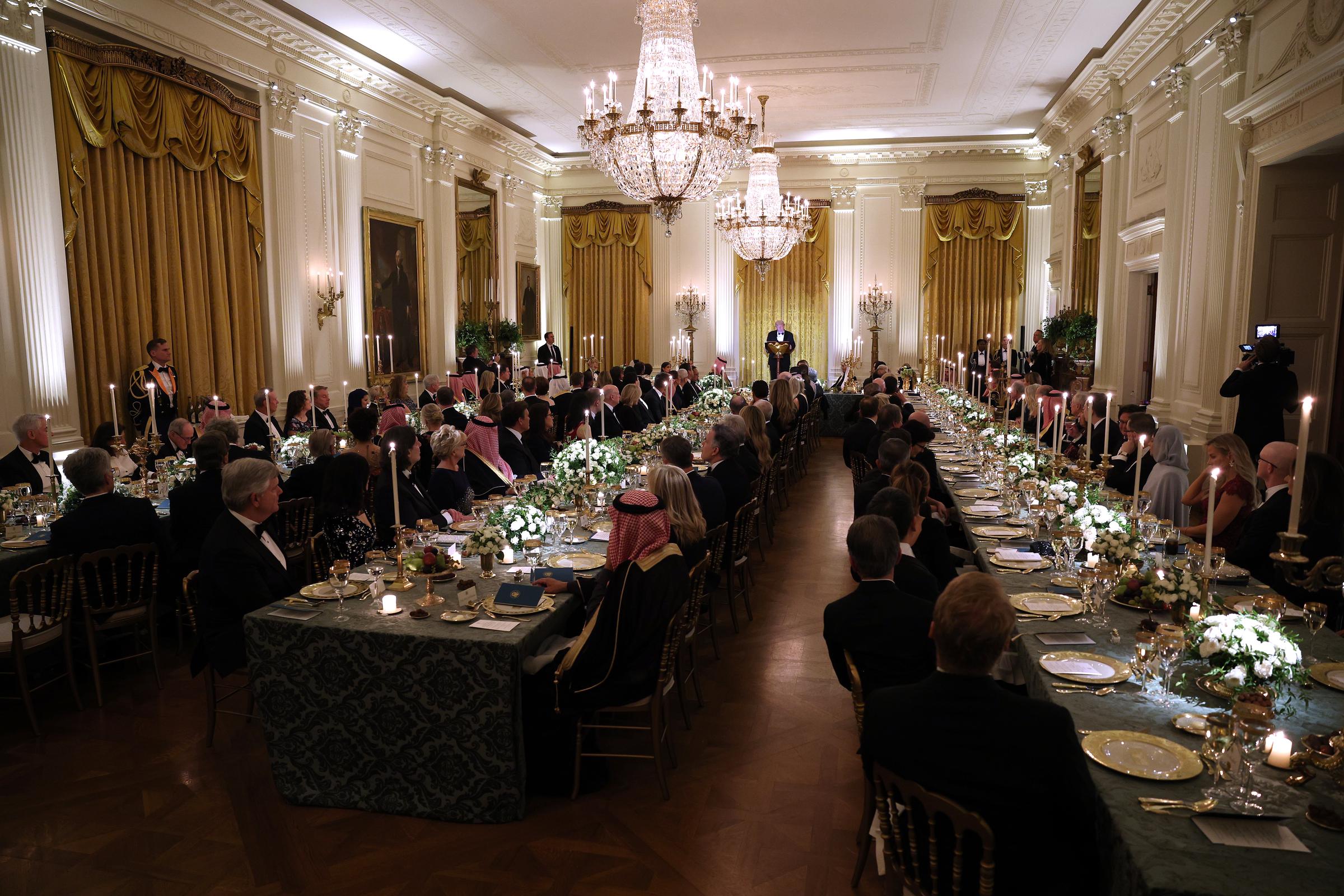 Wide view of the U.S.–Saudi Arabia state dinner in the East Room of the White House on November 18, 2025 | Source: Getty Images