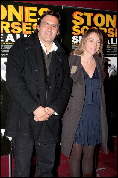 Emmanuel Chain et Valérie Guignabodet lors de la projection du film Shine A Light de Martin Scorsese à l'Olympia à Paris.  | Photo : Getty Images