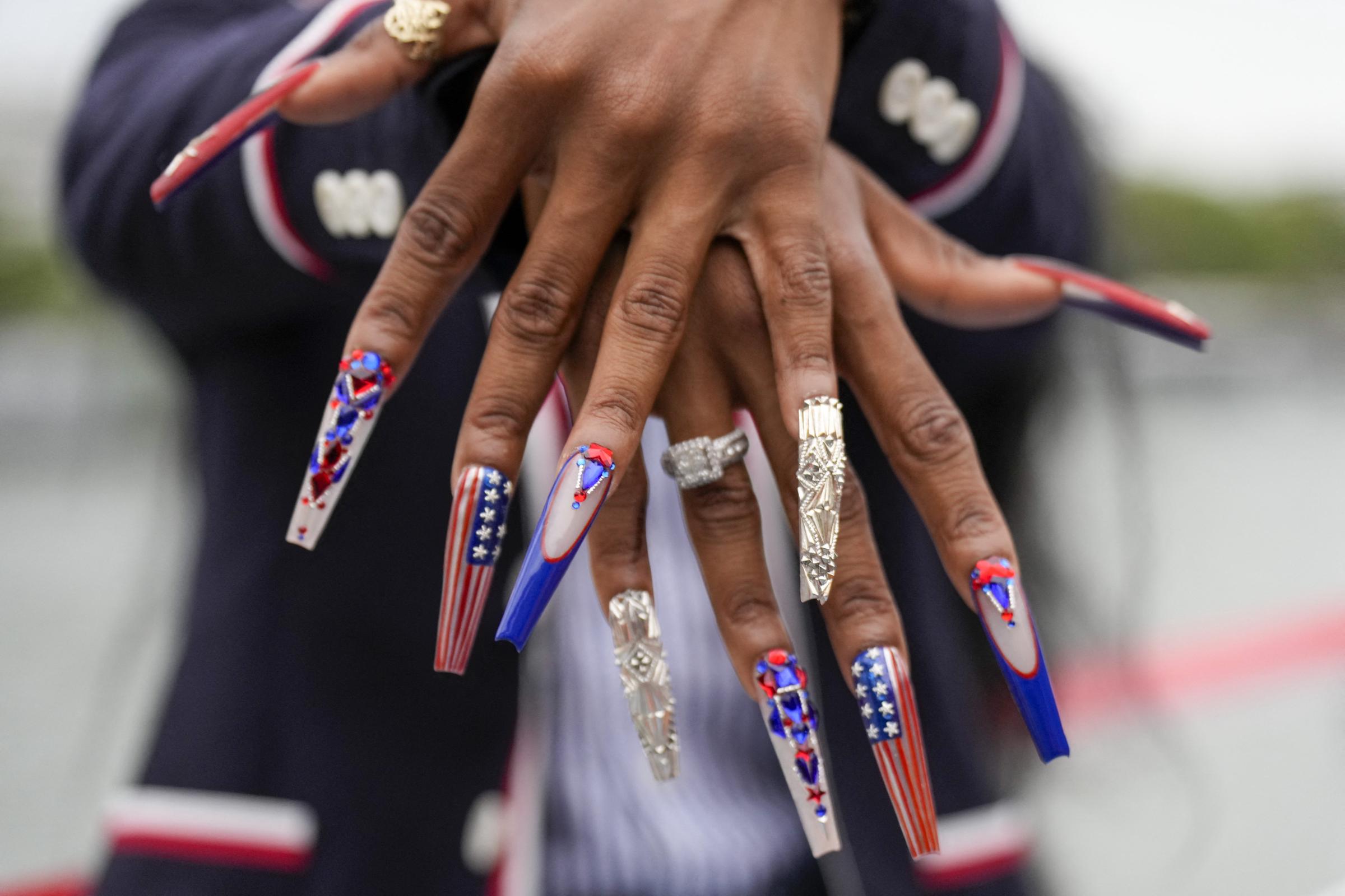 ShaCarri Richardson showing off her nails during the opening ceremony of the 2024 Paris Summer Olympics on July 26, 2024, in France.| Source: Getty Images