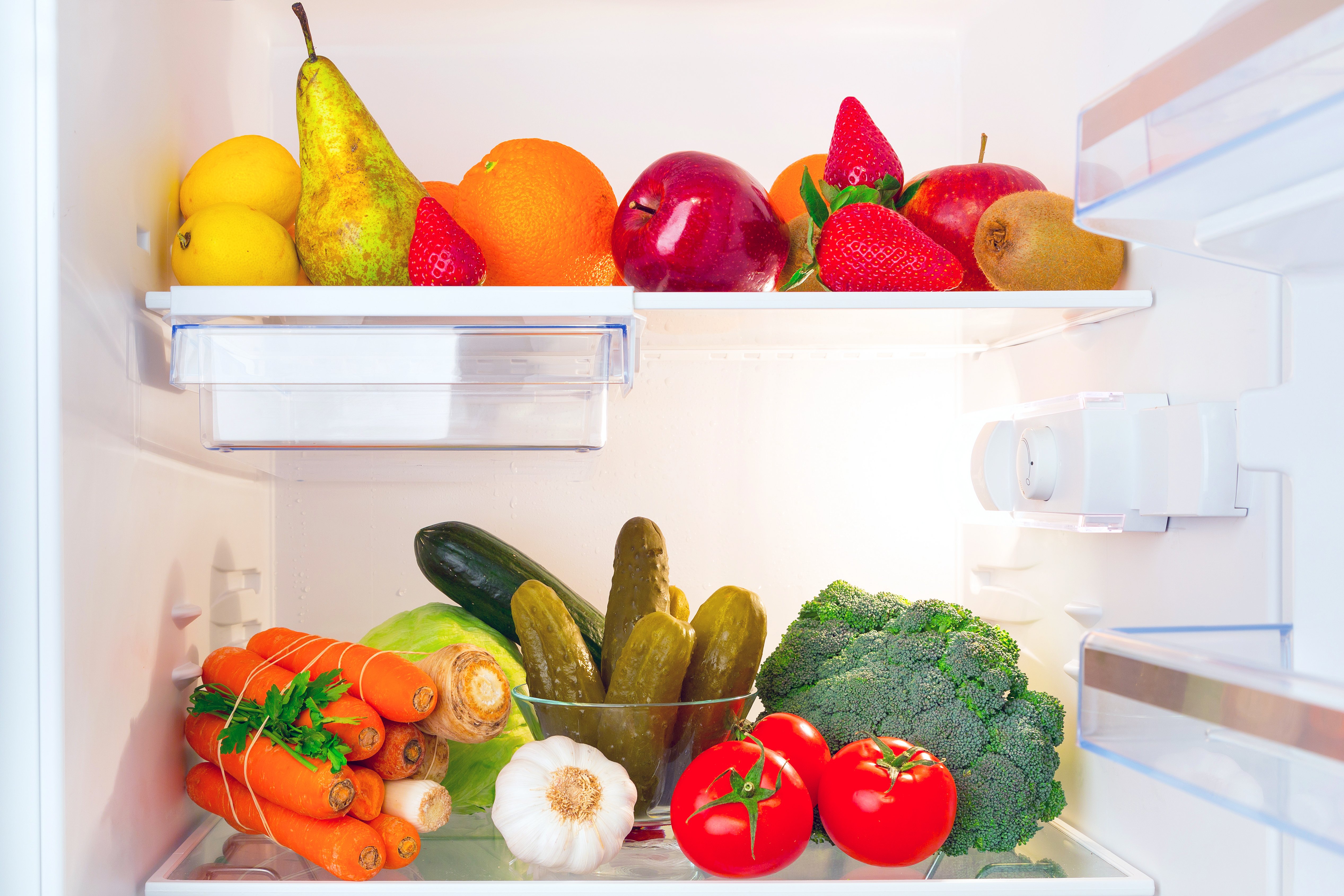 Fruits and vegetables in refrigerator | Shutterstock