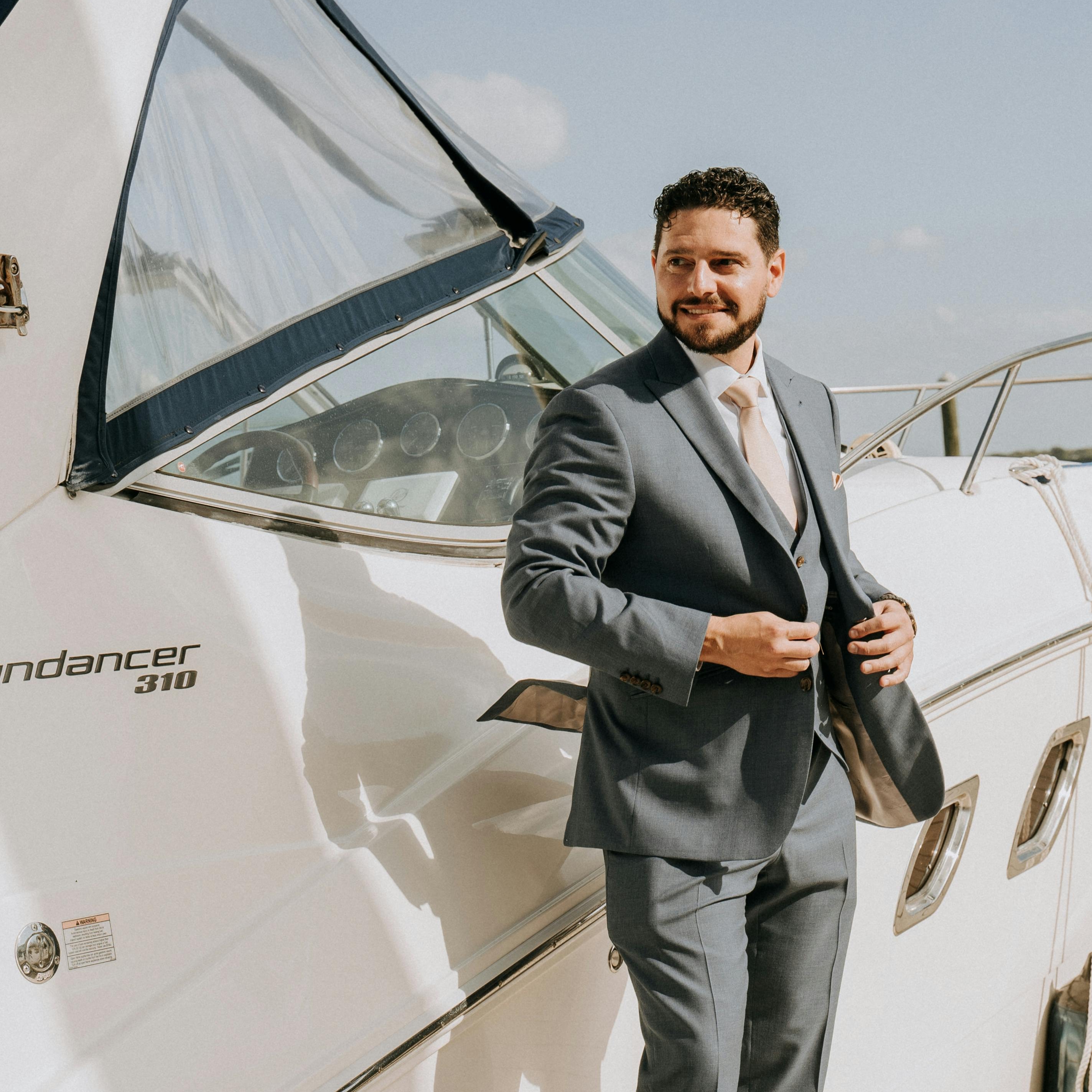 A man taking a position on the deck of a yacht | Source: Pexels